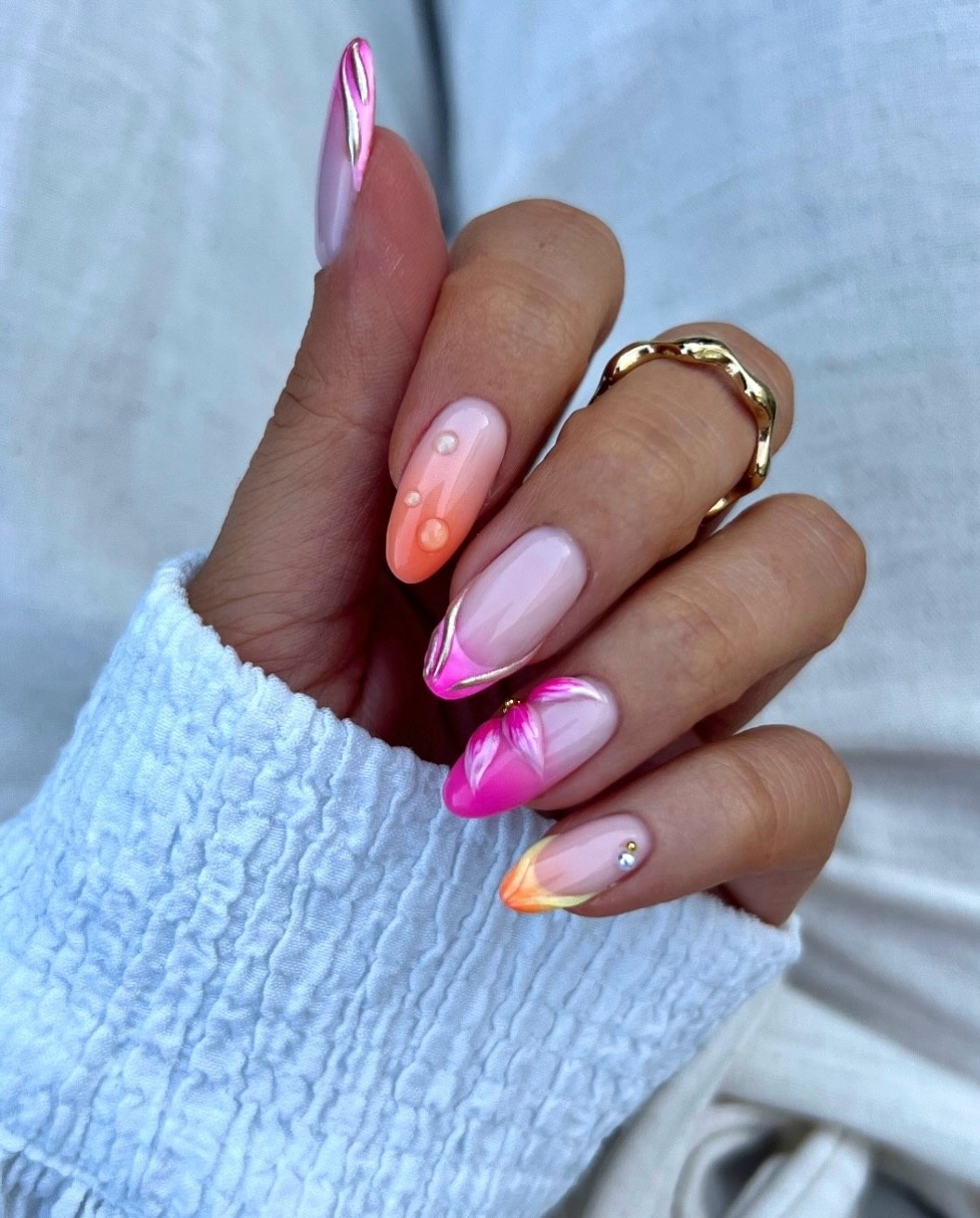 Gradient Ombre Almond Nails with Floral Accents