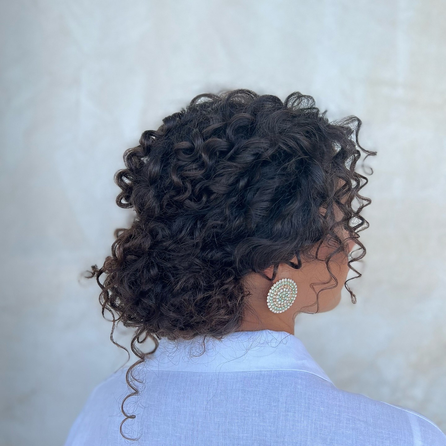 Textured Deep Side Part Curly Updo
