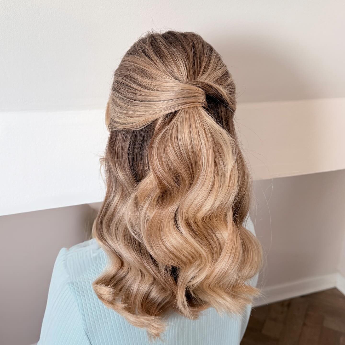 Twisted Half-Up Blonde Waves With Dimension