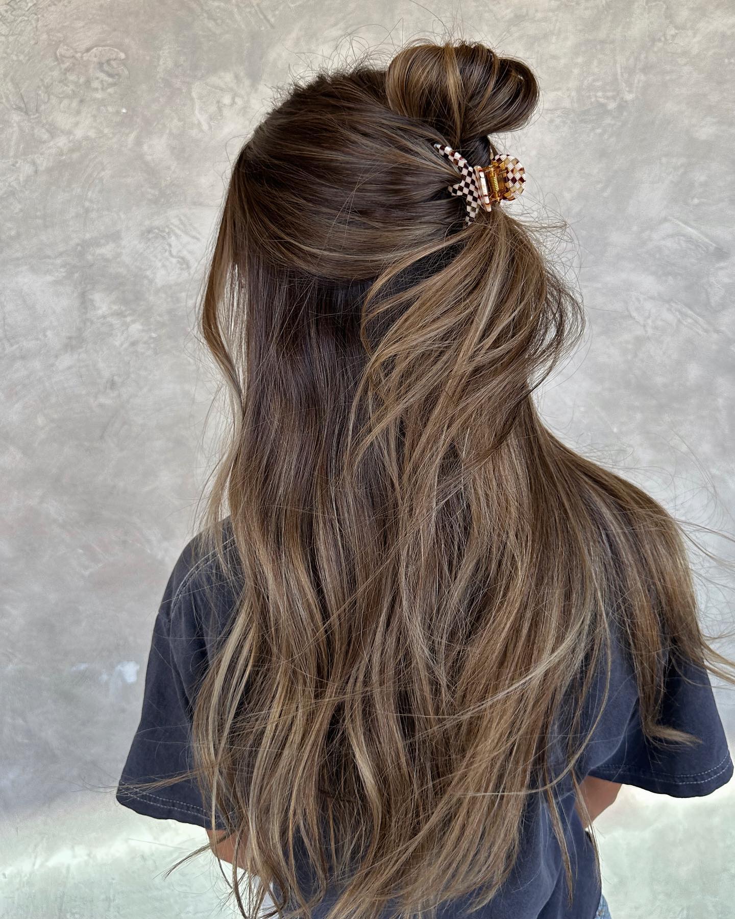 Half-Up Twisted Bun With Checkerboard Claw Clip