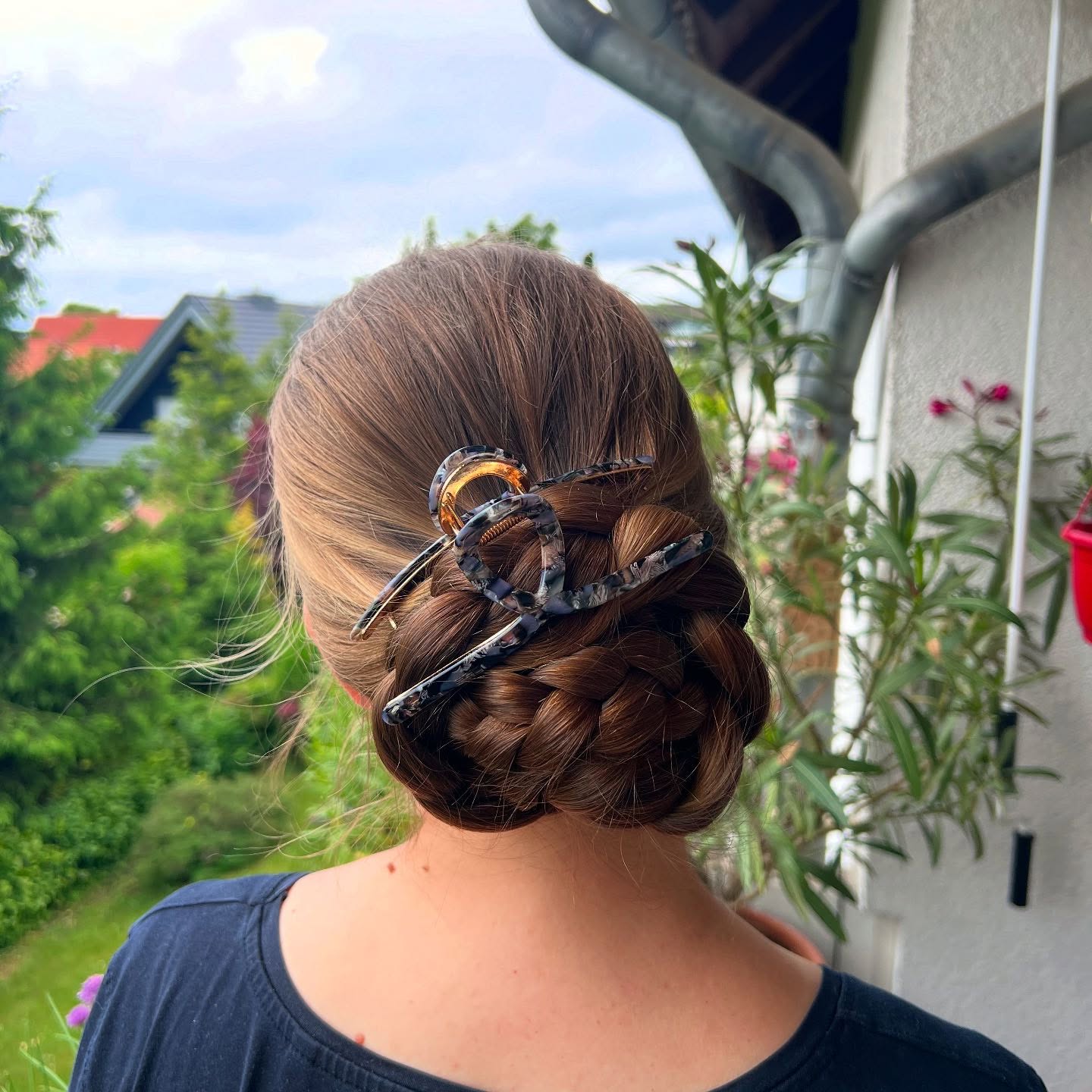 Chic Braided Updo With Tortoiseshell Claw Clip