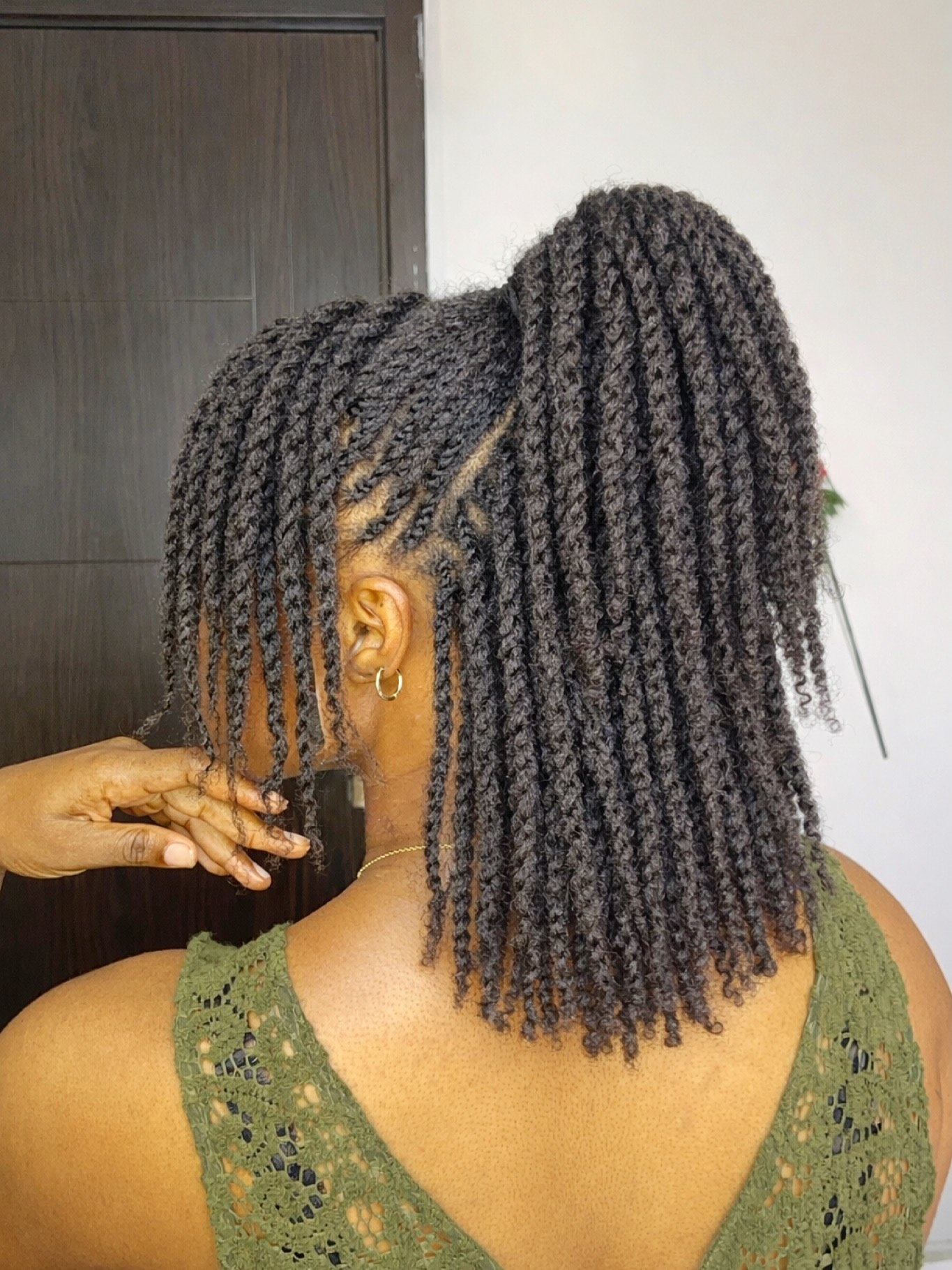 High Ponytail With Defined Mini Twists