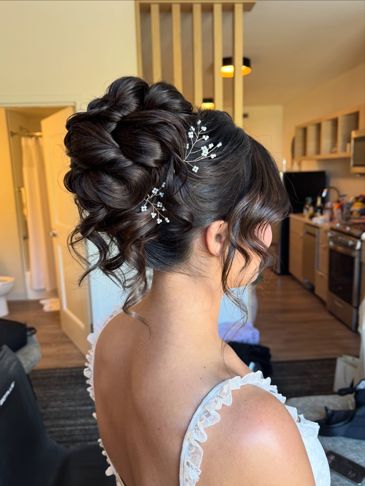 Elegant Braided Updo With Loose Waves And Pearls