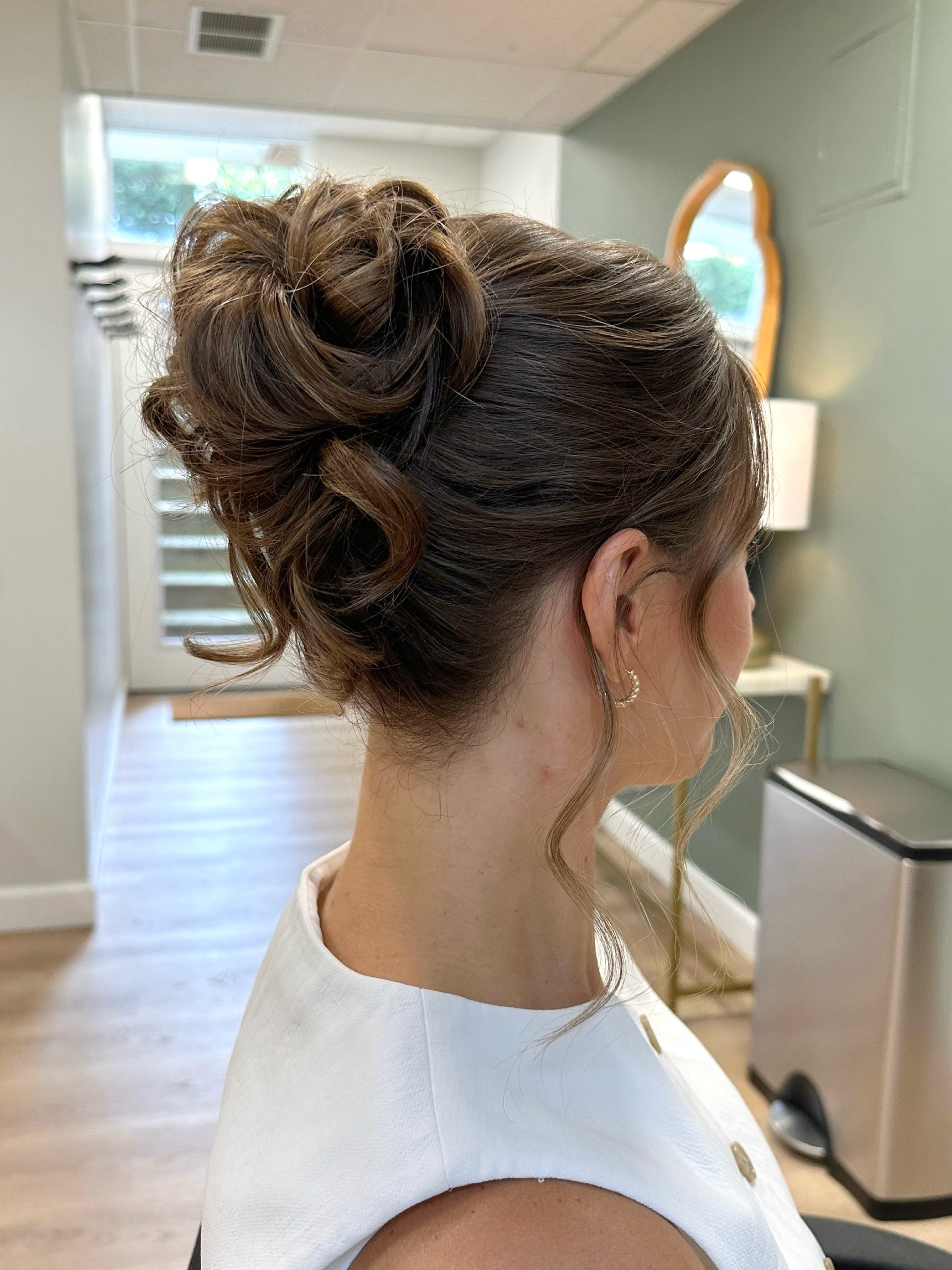 Textured Chignon With Wispy Tendrils