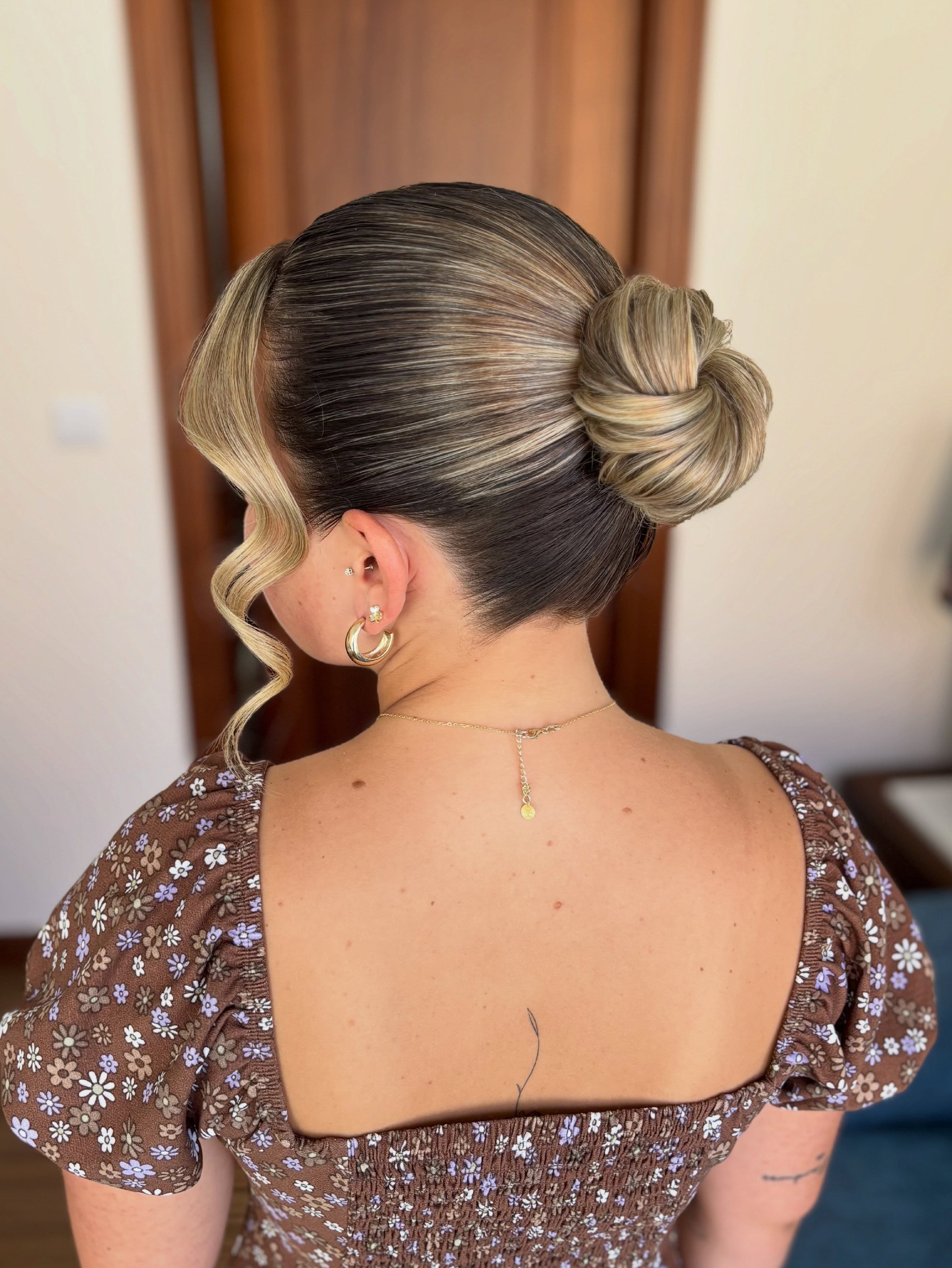 Chic Woven Low Bun With Face-Framing Curls