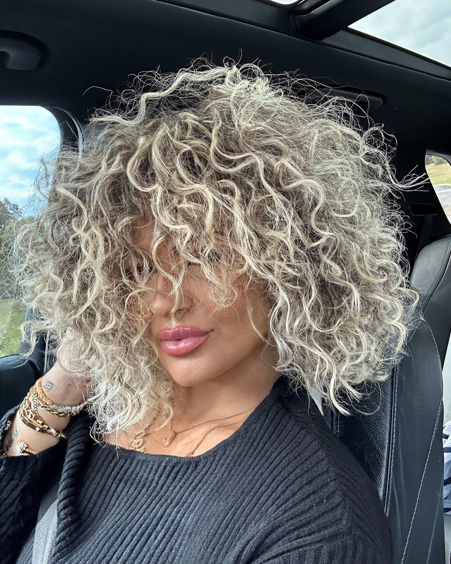 Platinum Blonde Curly Shag With Wispy Bangs