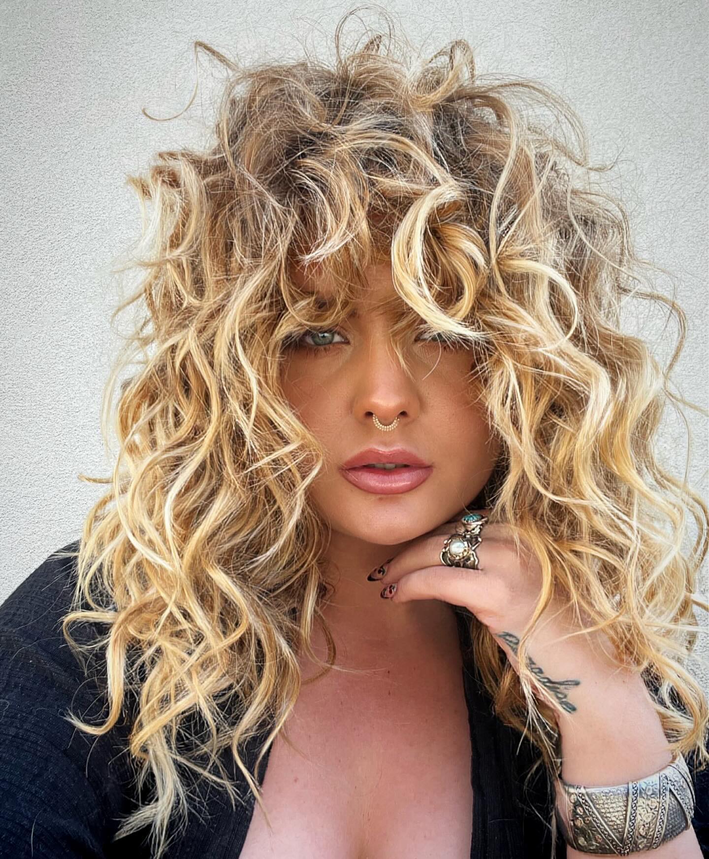 Tousled Honey Blonde Curly Shag With Face-Framing Bangs