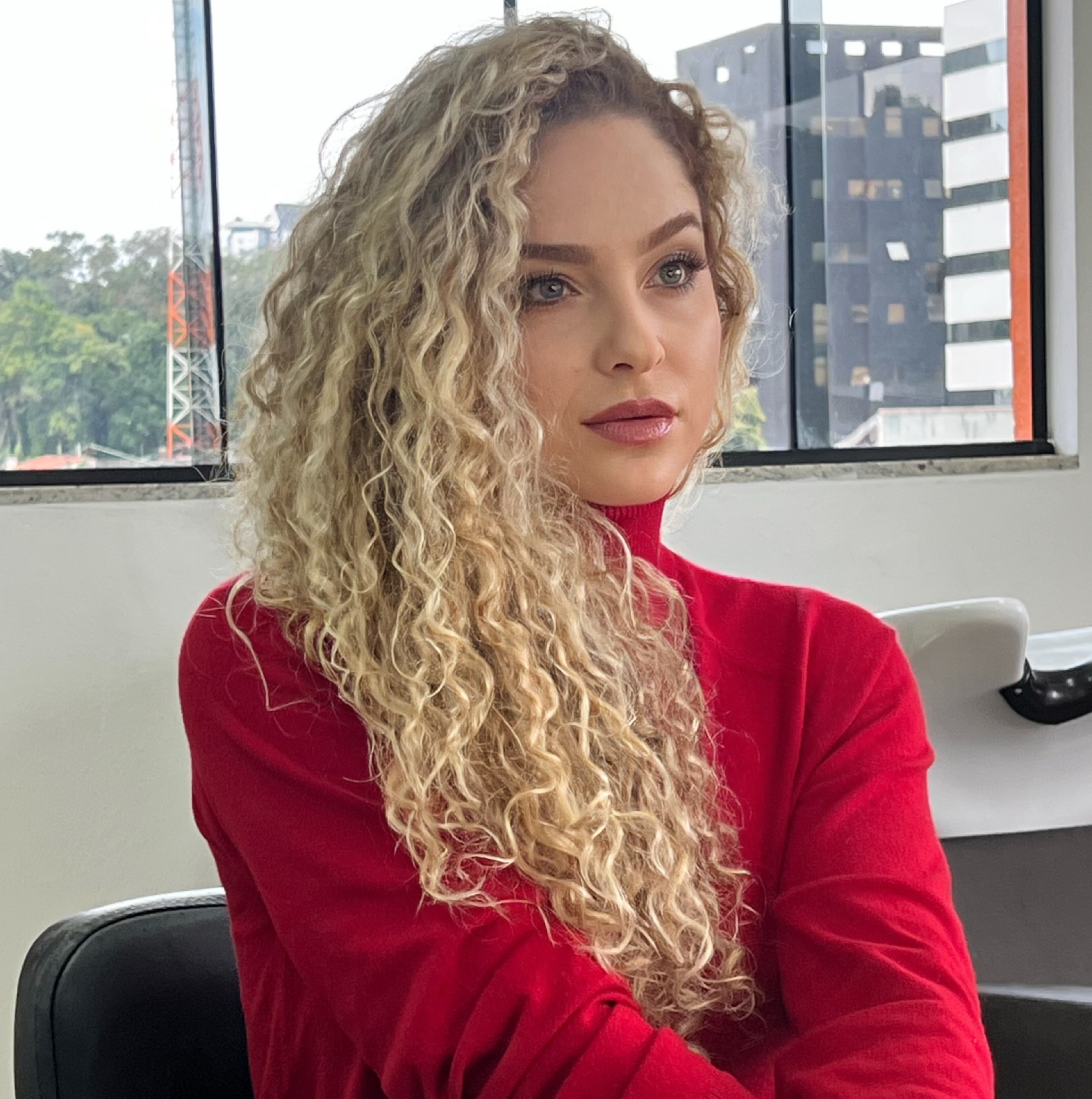 Voluminous Honey Blonde Curls With Face-Framing Layers