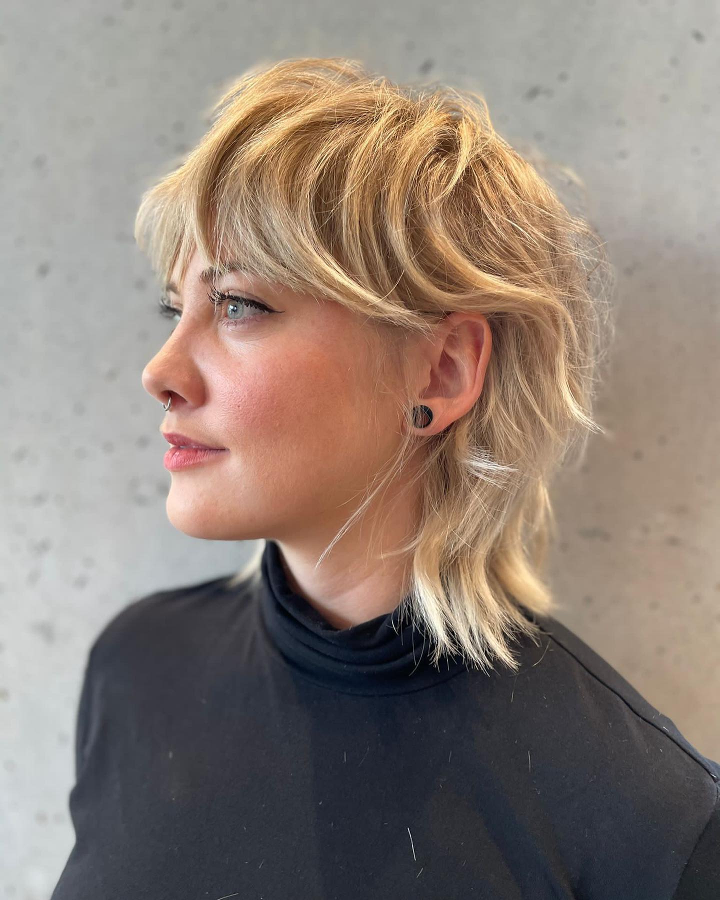 Shaggy Blonde Mullet With Tousled Curtain Bangs