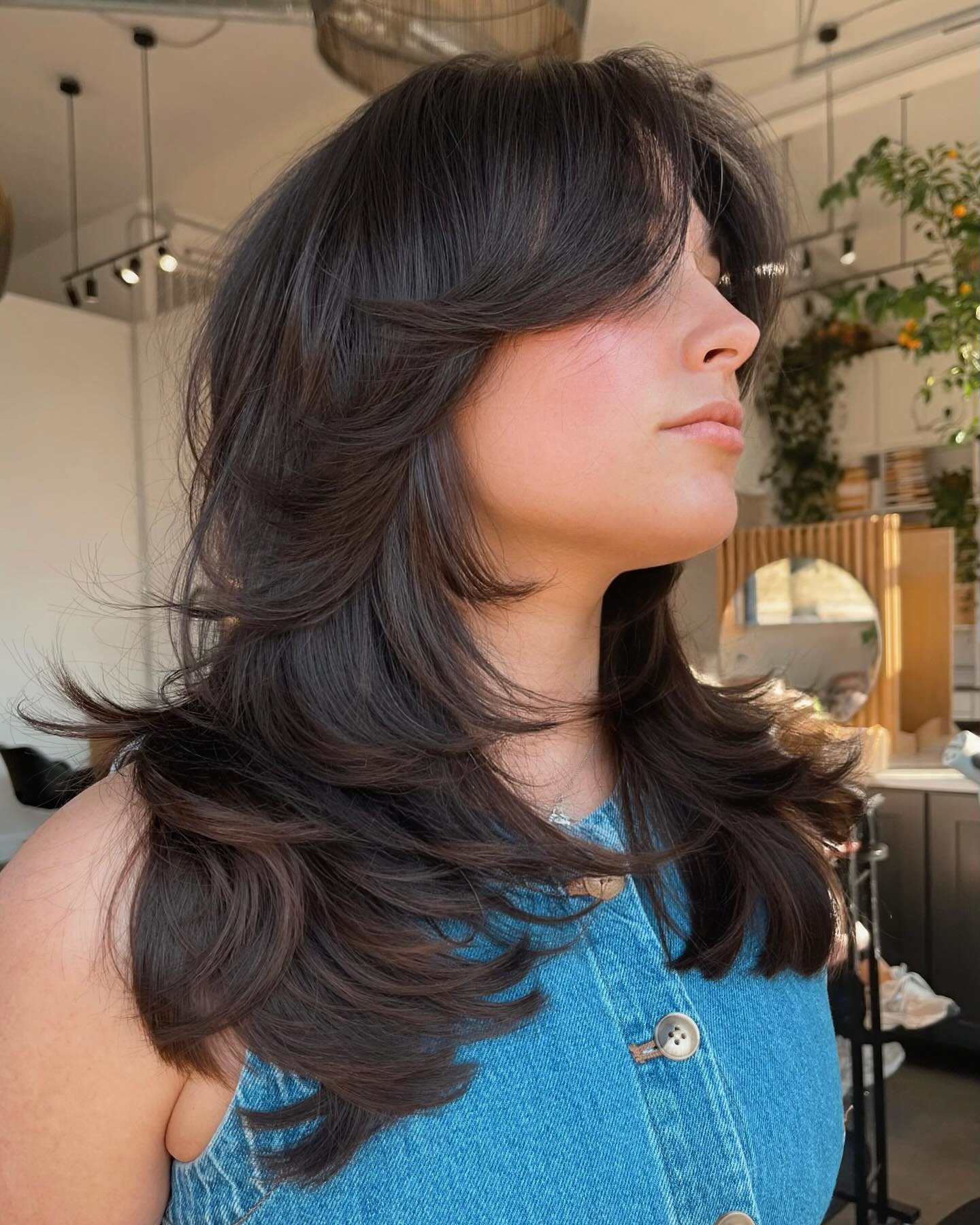 Voluminous Layered Cut With Face-Framing Bangs