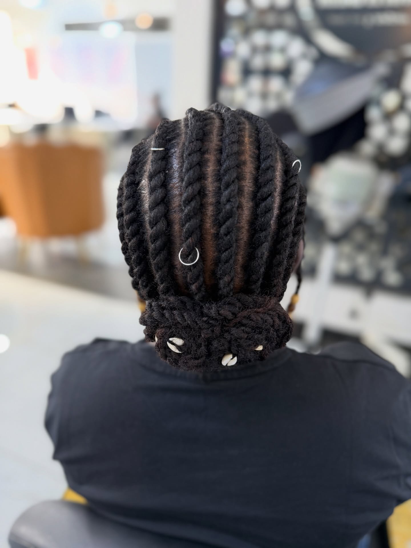 Elegant Flat Twists Updo With Shell Adornments