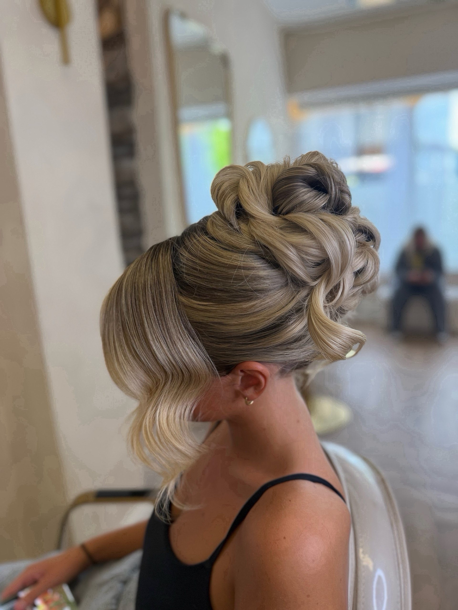Elegant Twisted Updo With Face-Framing Waves