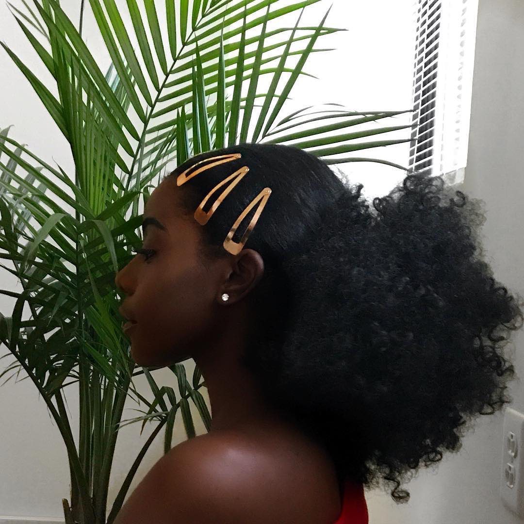 Sleek High Ponytail With Defined Coils