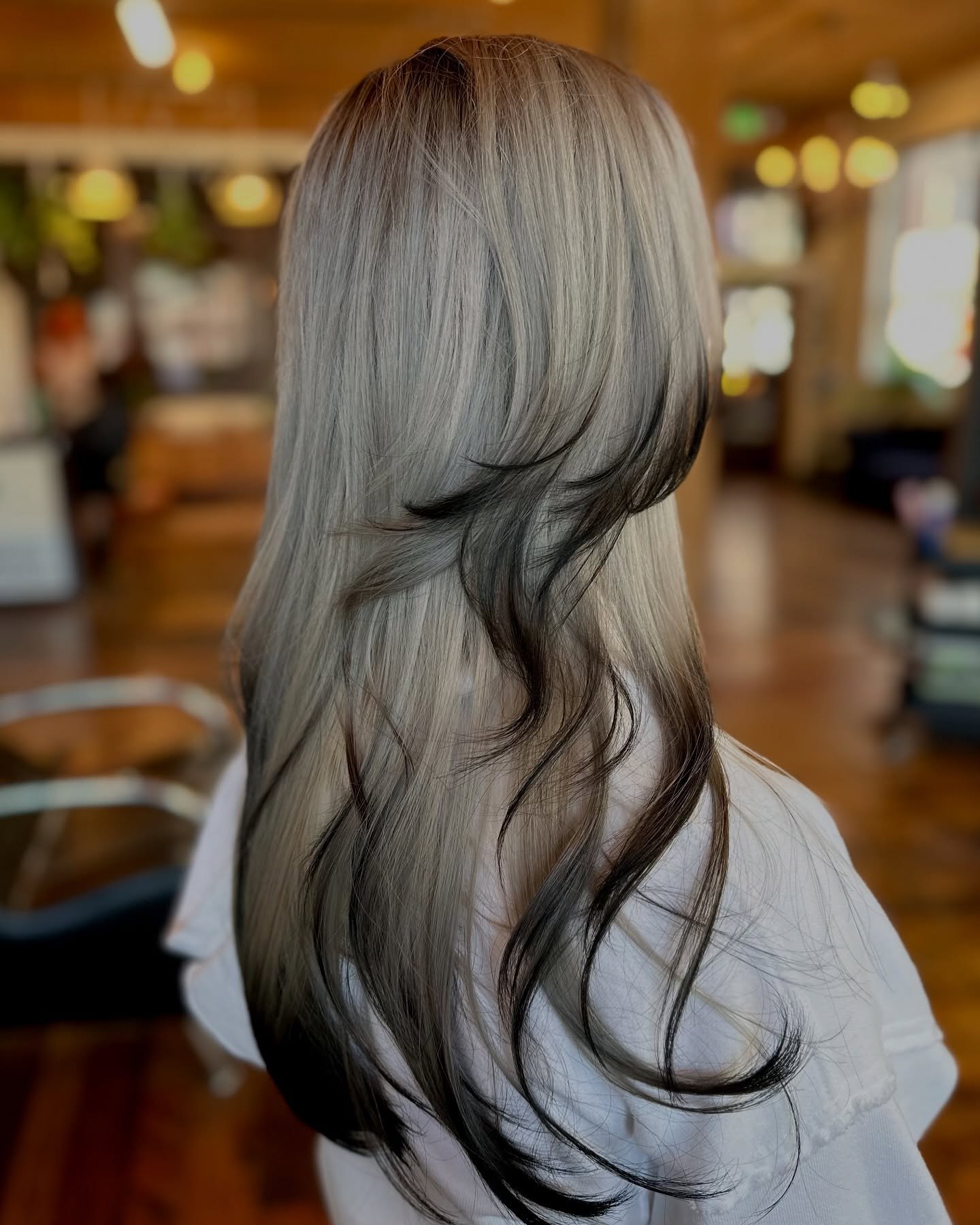 Edgy Black Highlights on Ash Blonde Layers