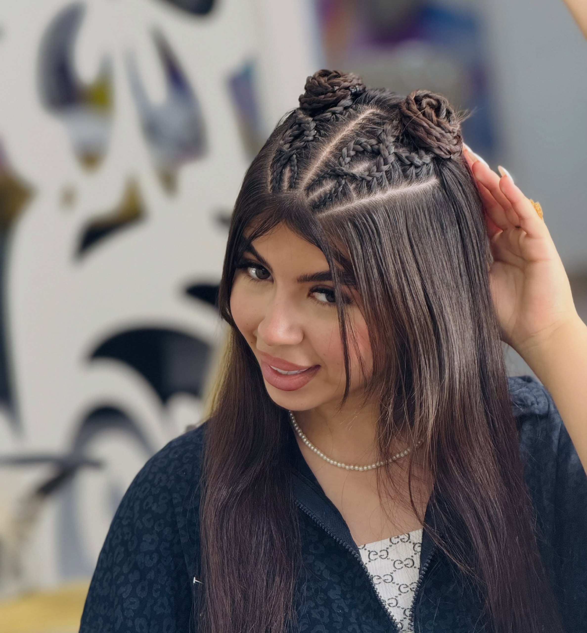 Braided Space Buns With Face Framing Strands