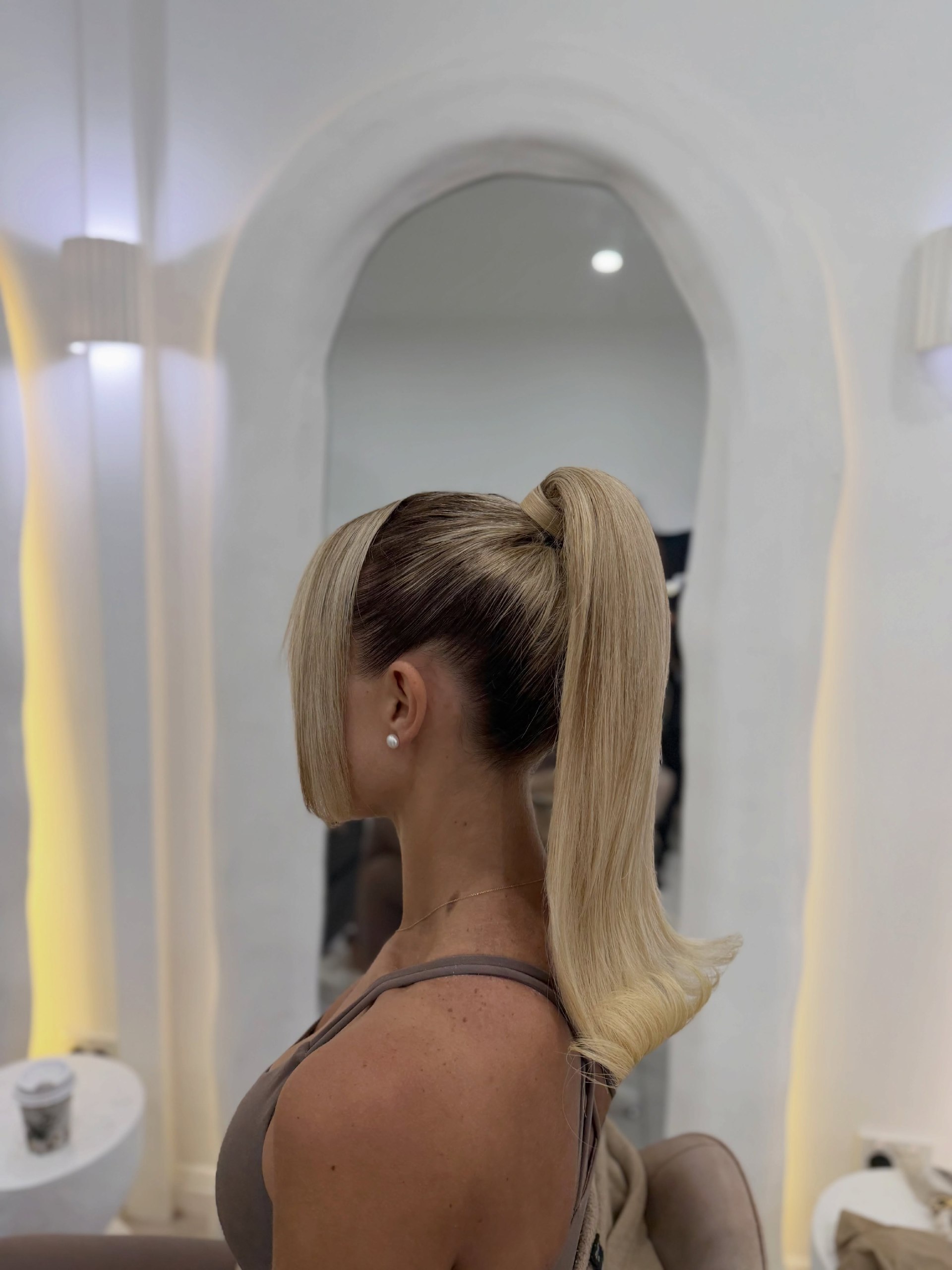 Sleek High Ponytail With Face-Framing Bangs