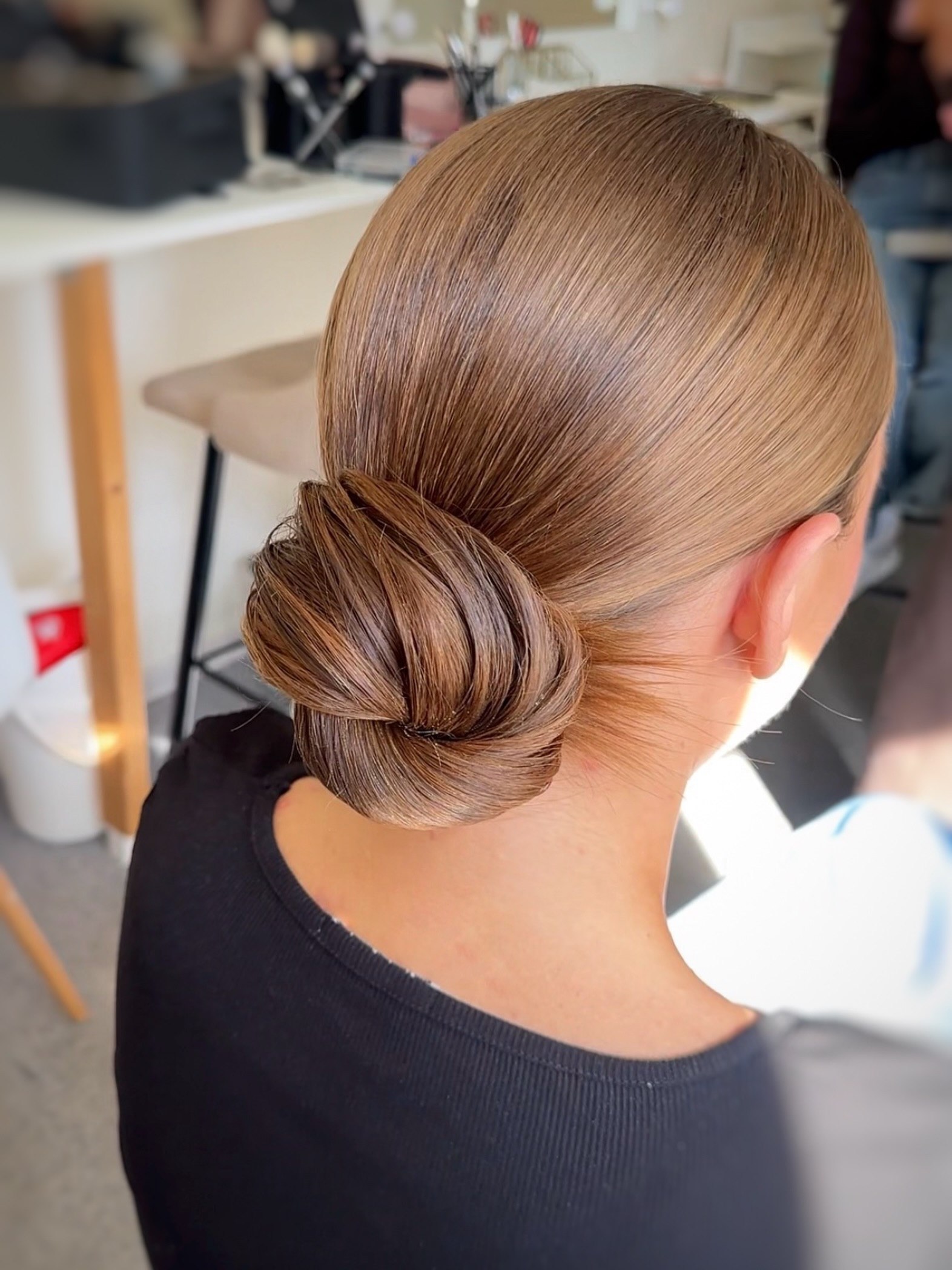 Sleek Chignon Work Hairstyle With Golden Blonde