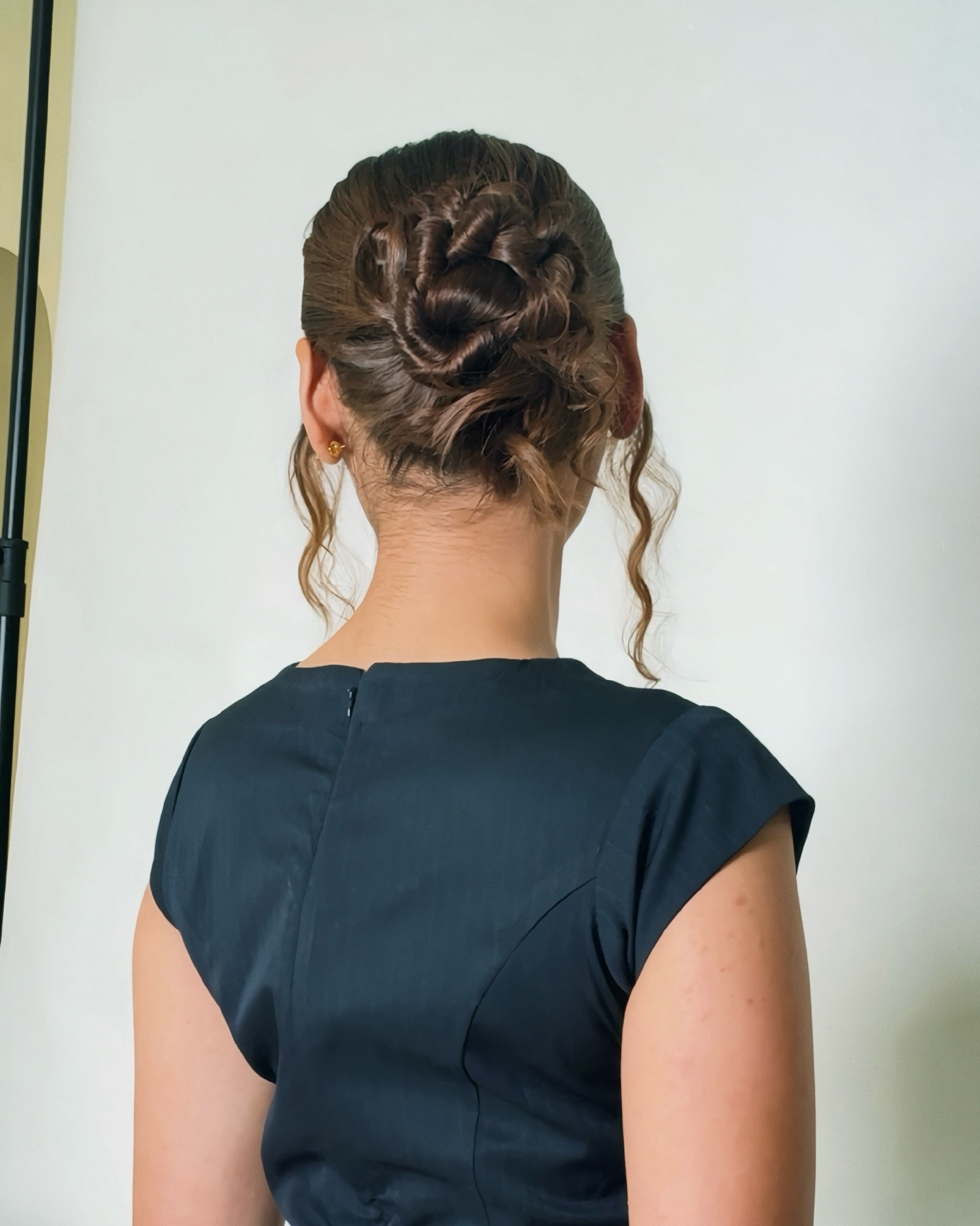 Elegant Twisted Updo With Loose Tendrils