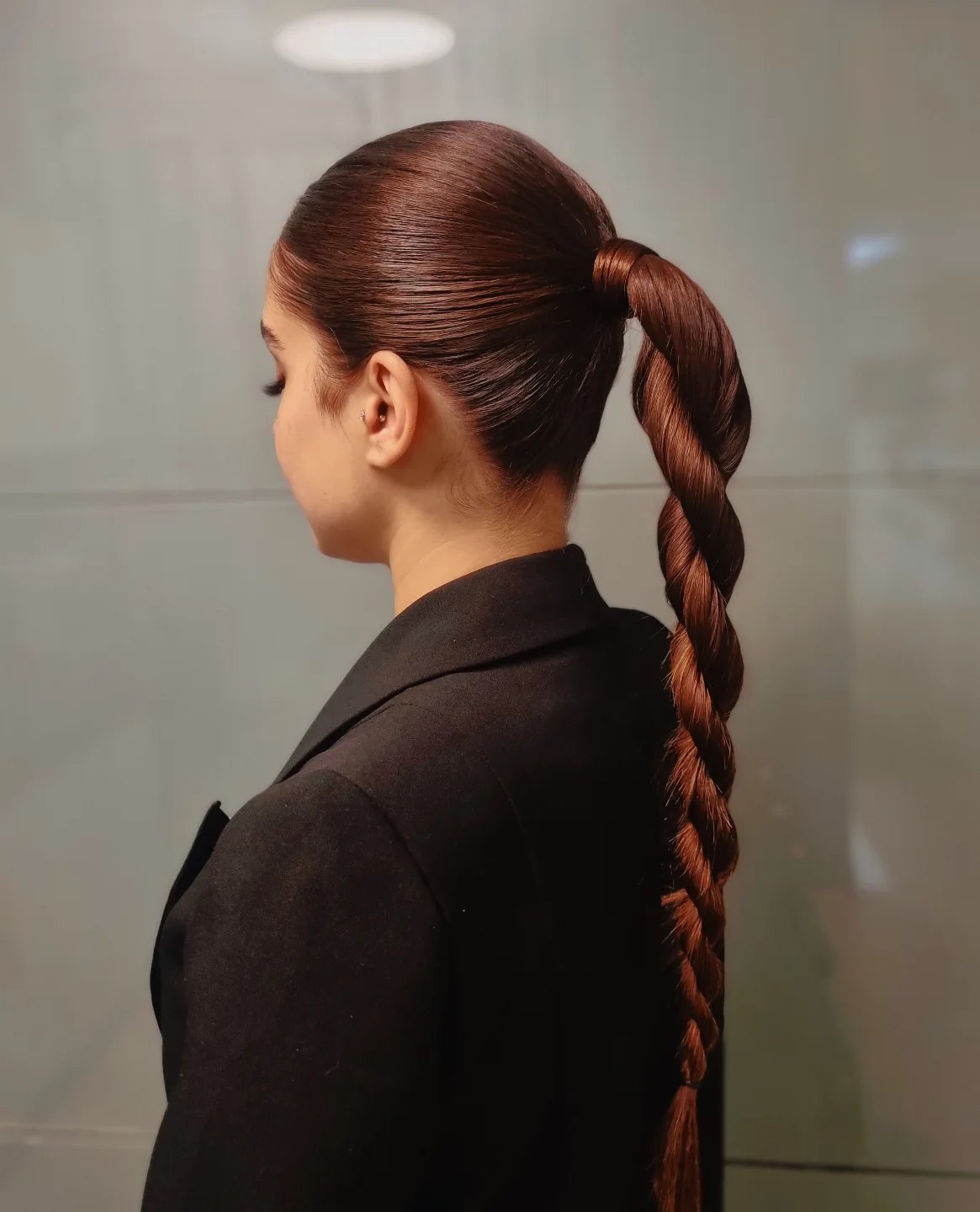 Sleek High Ponytail With A Twisted Braid