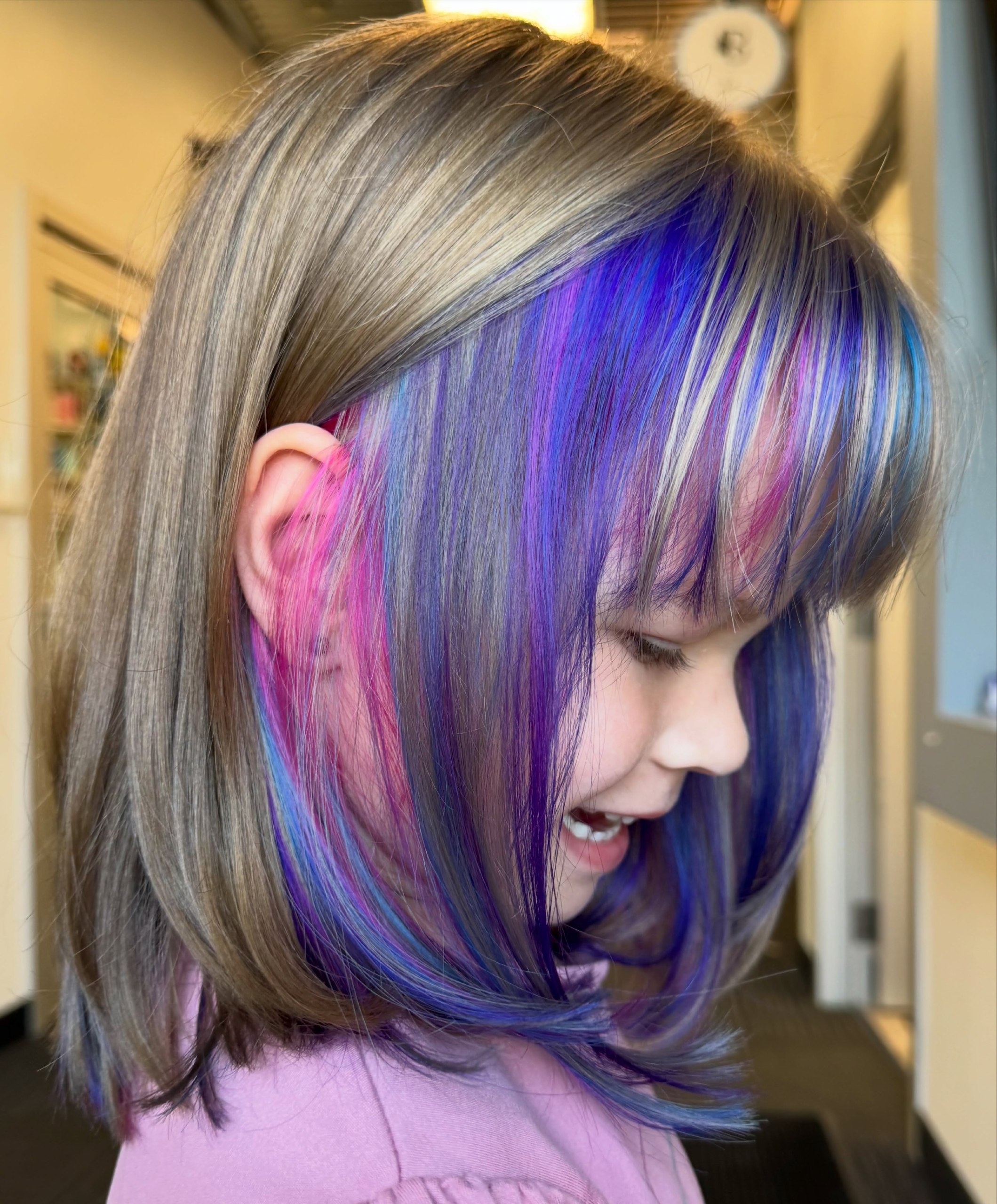 Playful Rainbow Peekaboo Streaks In A Bob