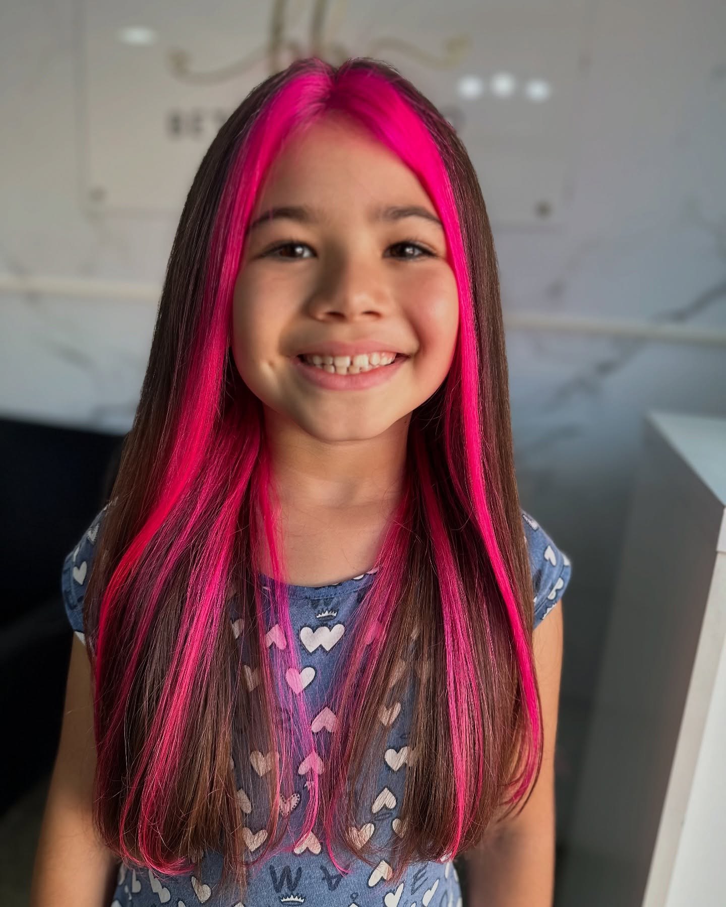 Bold Pink Face-Framing Streaks With Long Brown Hair