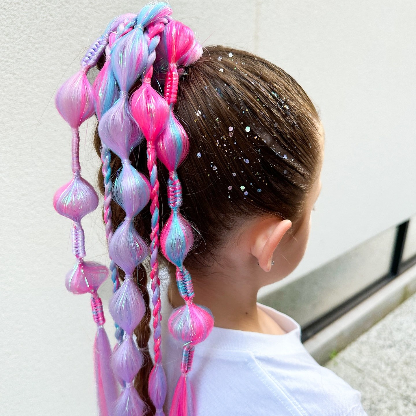 Whimsical Bubble Braids With Glitter Accents