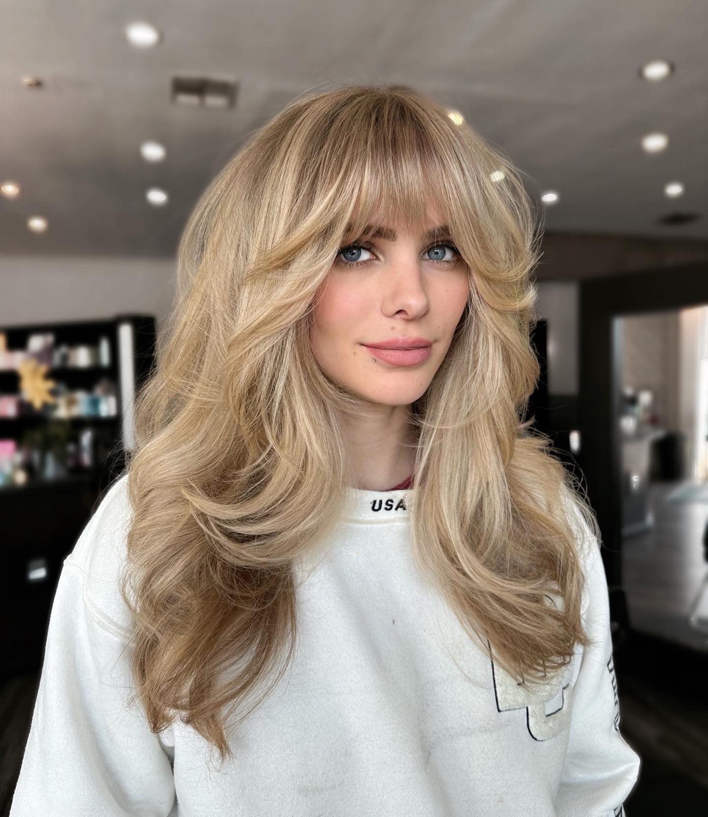 Blonde Feathered Bangs With Voluminous Layers