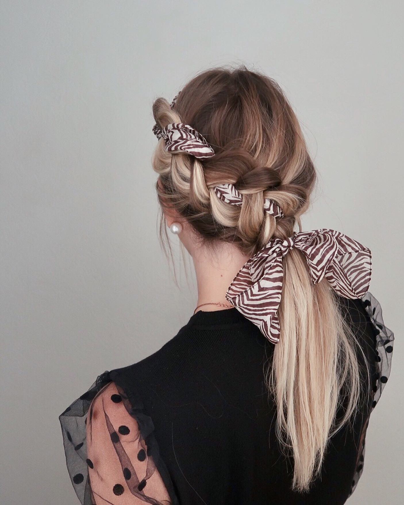 Braided Ponytail With Chic Zebra Print Scarf