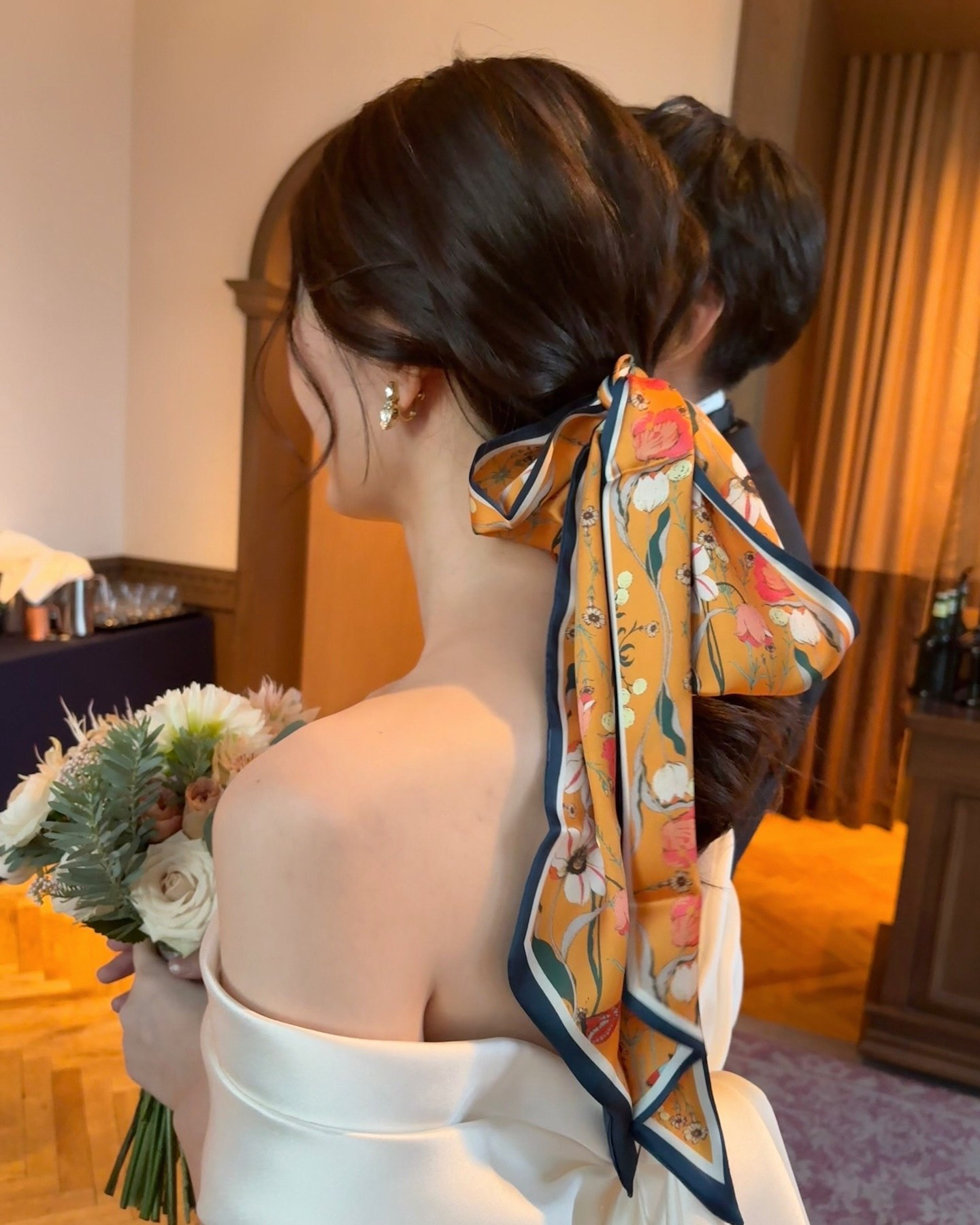 Elegant Low Ponytail With Floral Scarf Accent