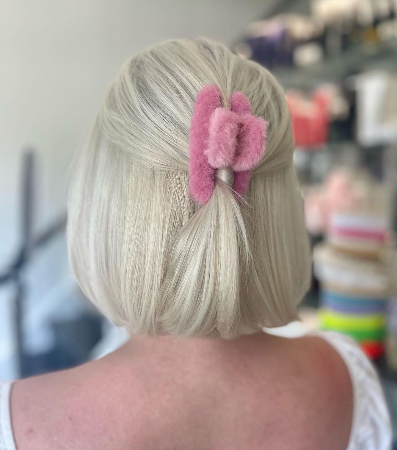 Platinum Blonde Bob With Fuzzy Pink Claw Clip