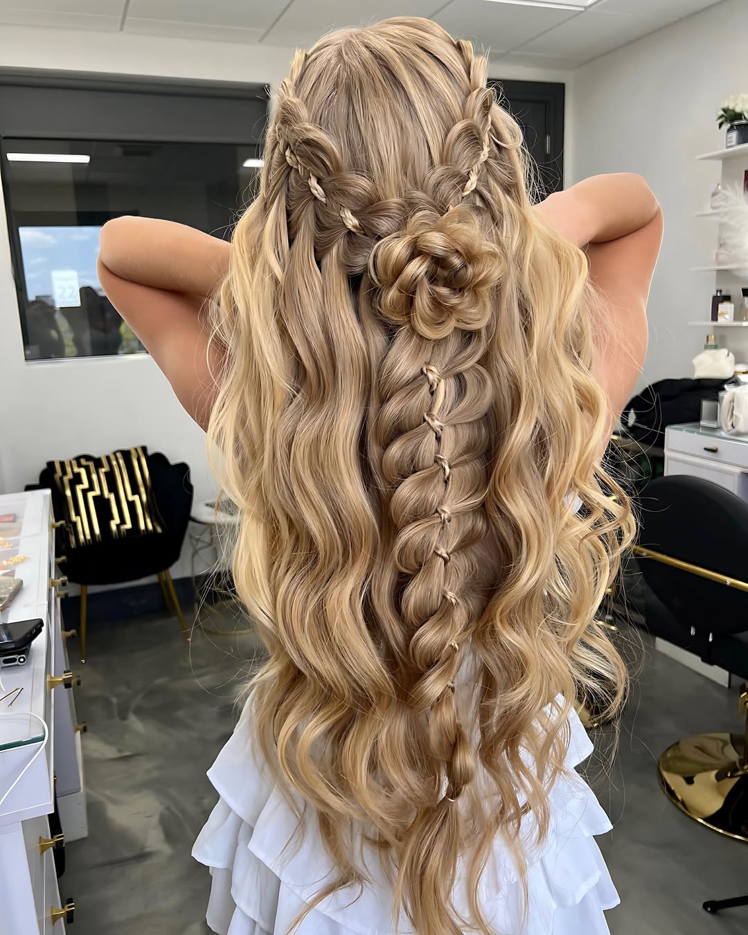 Elaborate Braided Flower Updo With Loose Waves