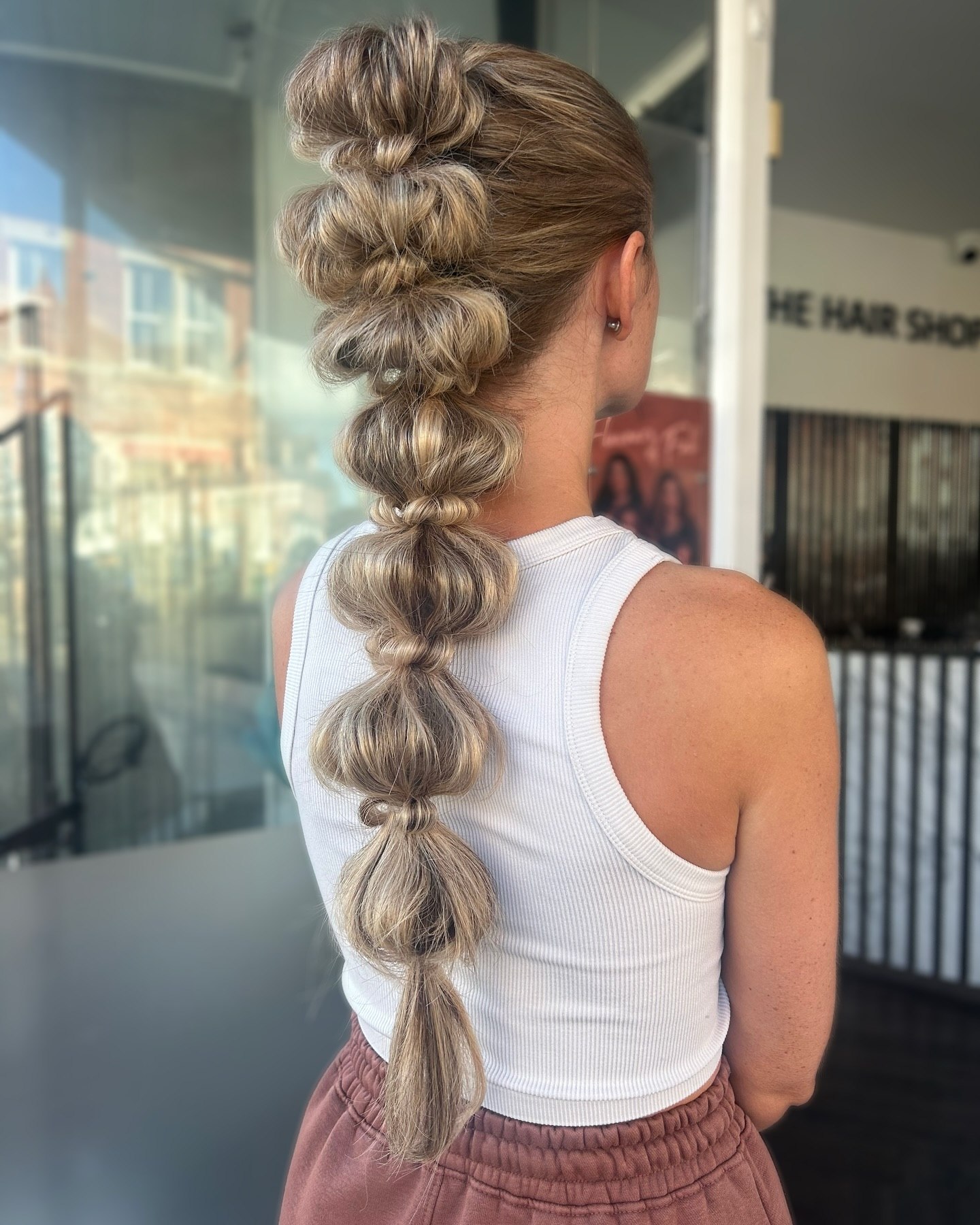 Voluminous High Bubble Braid With Dimensional Highlights