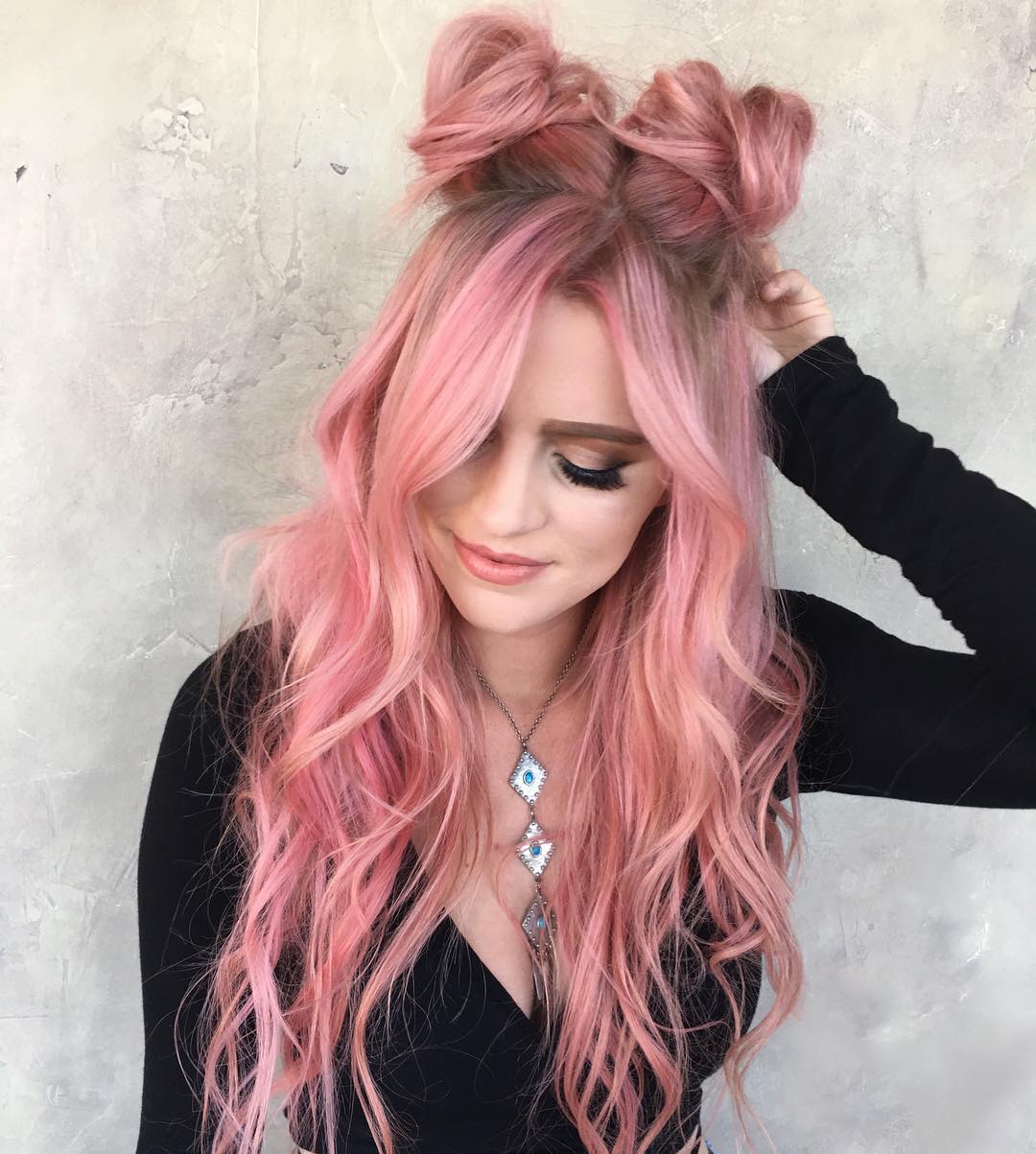 Pastel Pink Space Buns With Face Framing Waves
