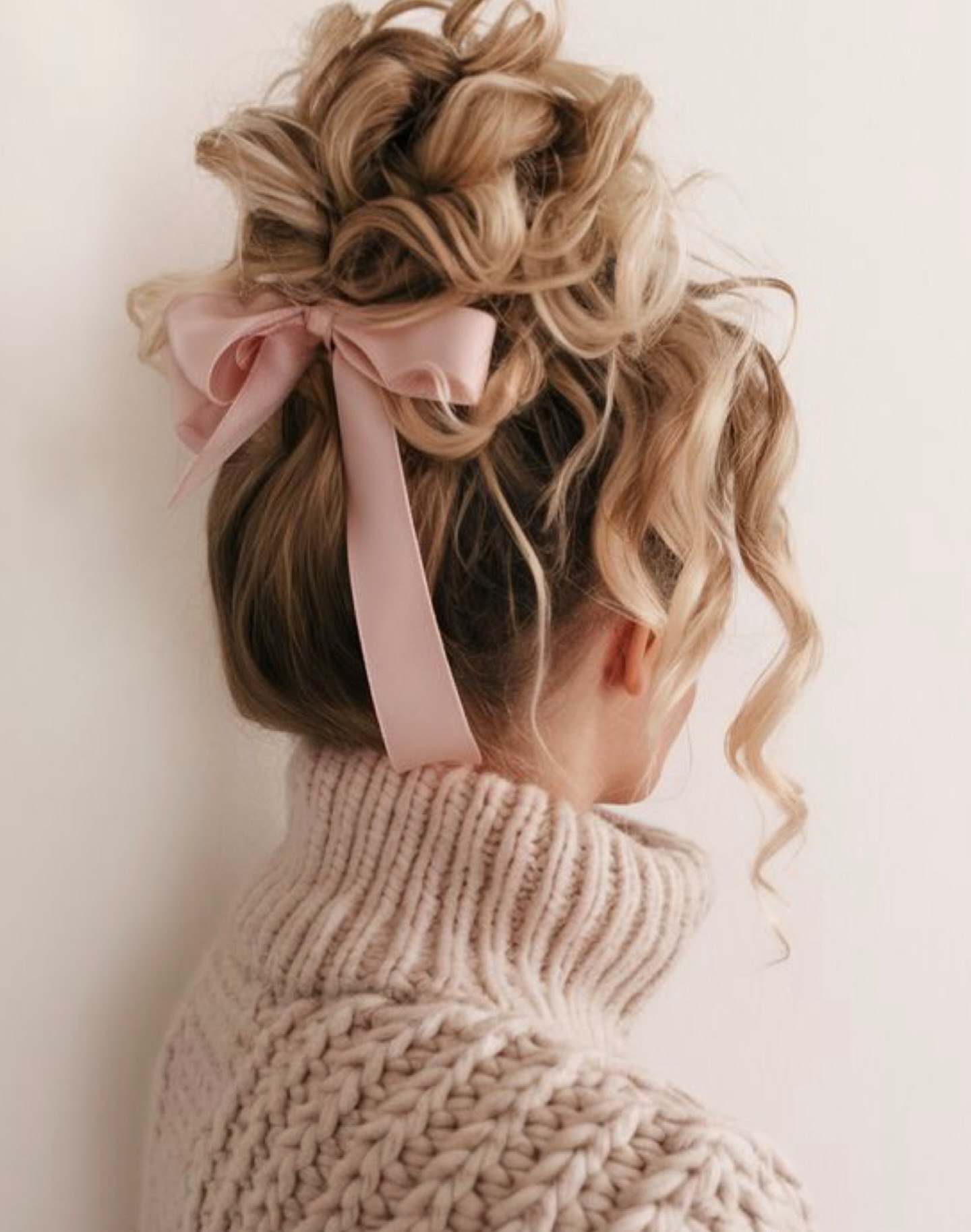 Messy Updo With Light Pink Ribbon Bow