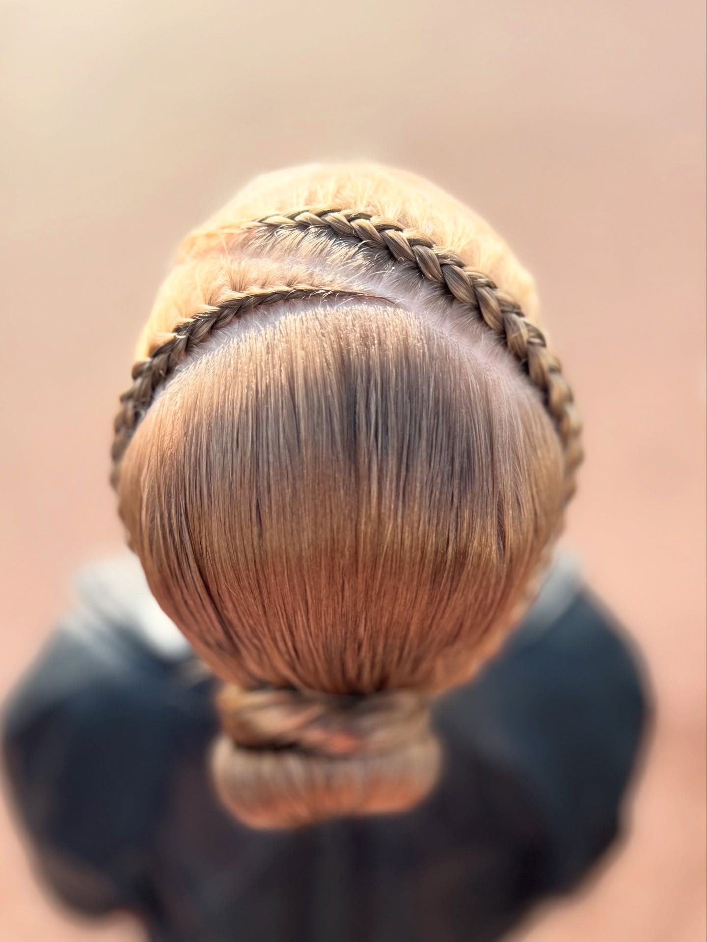 Double Dutch Braids Into Sleek Low Bun