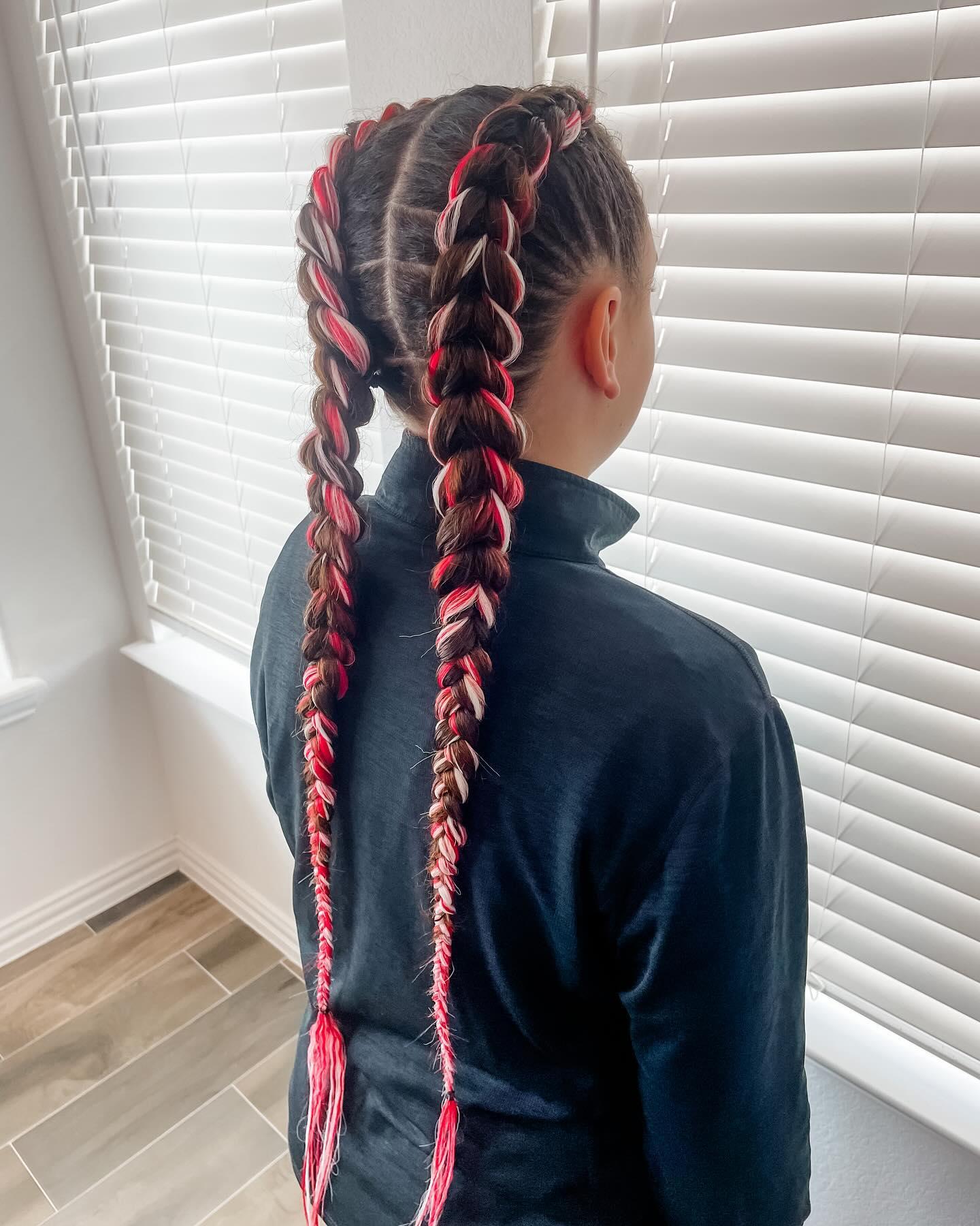 Sporty Double Braids With Red and White Streaks