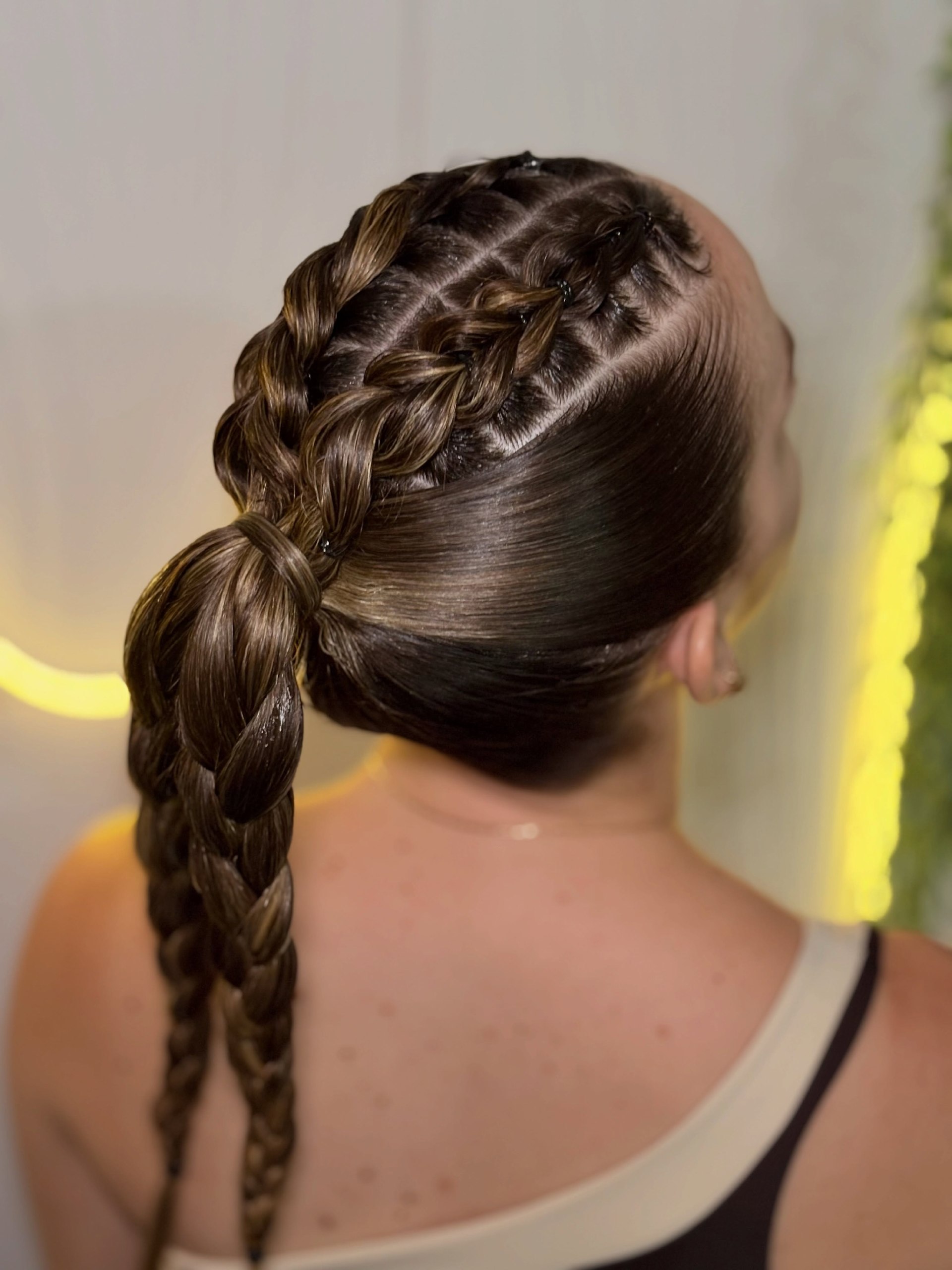 Sleek Braided Ponytail With Sharp Partings