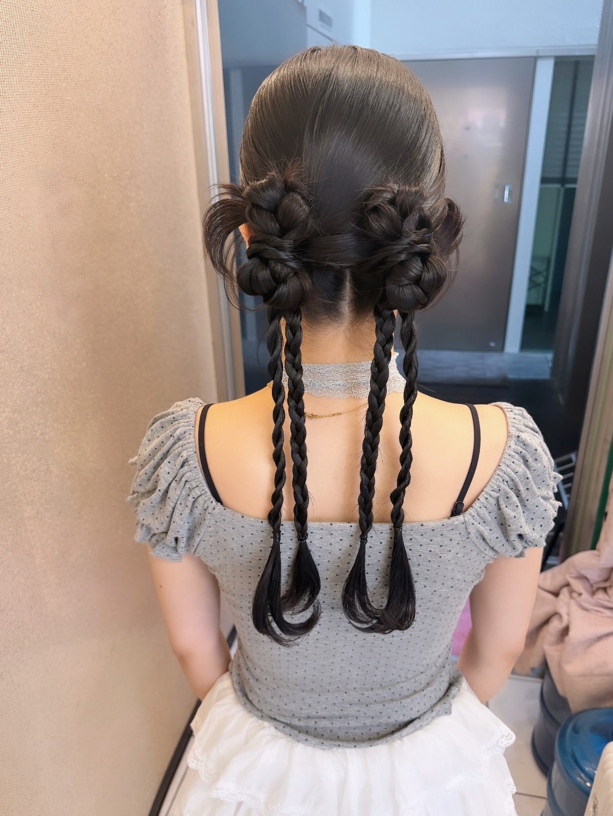 Double Braided Buns With Cascading Braids