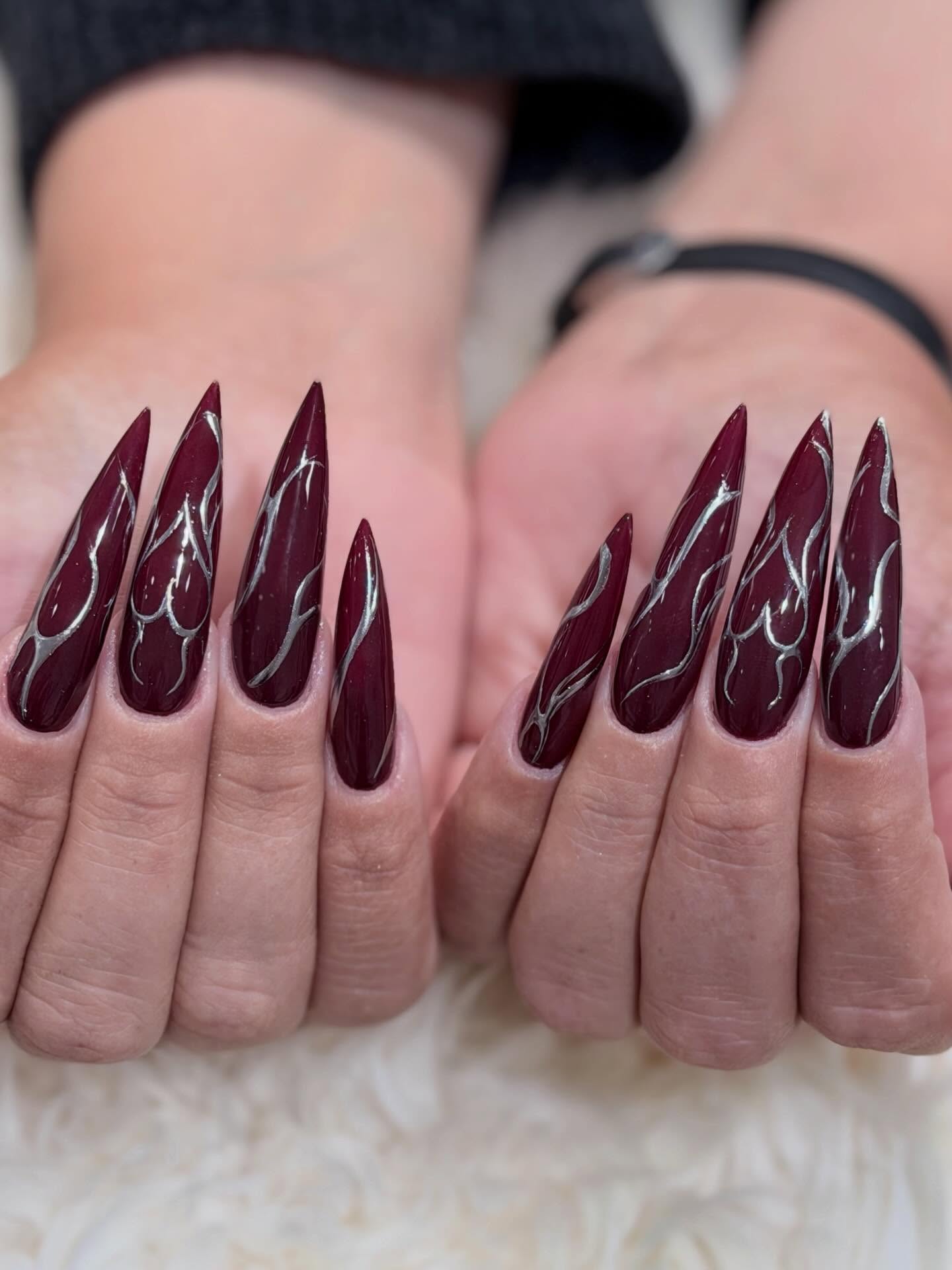 Deep Burgundy Stiletto Nails with Silver Flame Art