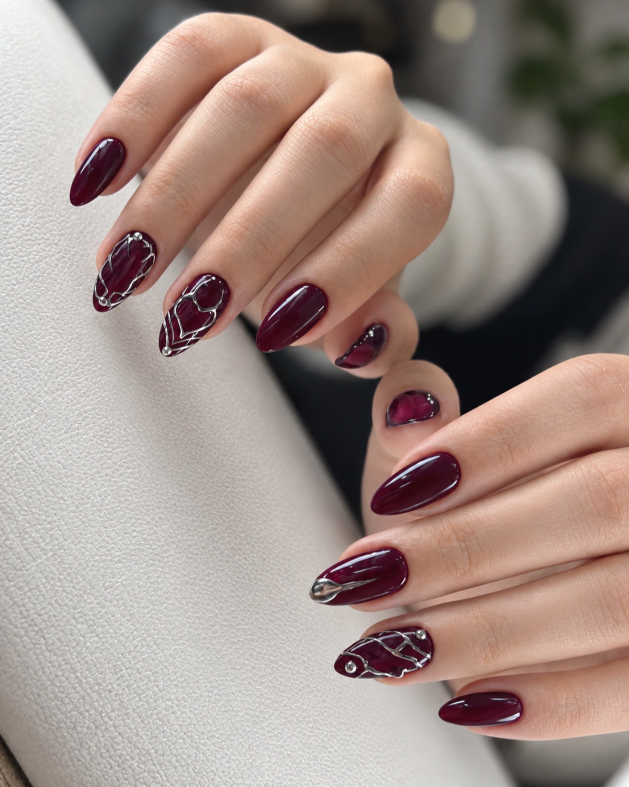 Burgundy Oval Nails With Silver Abstract Art