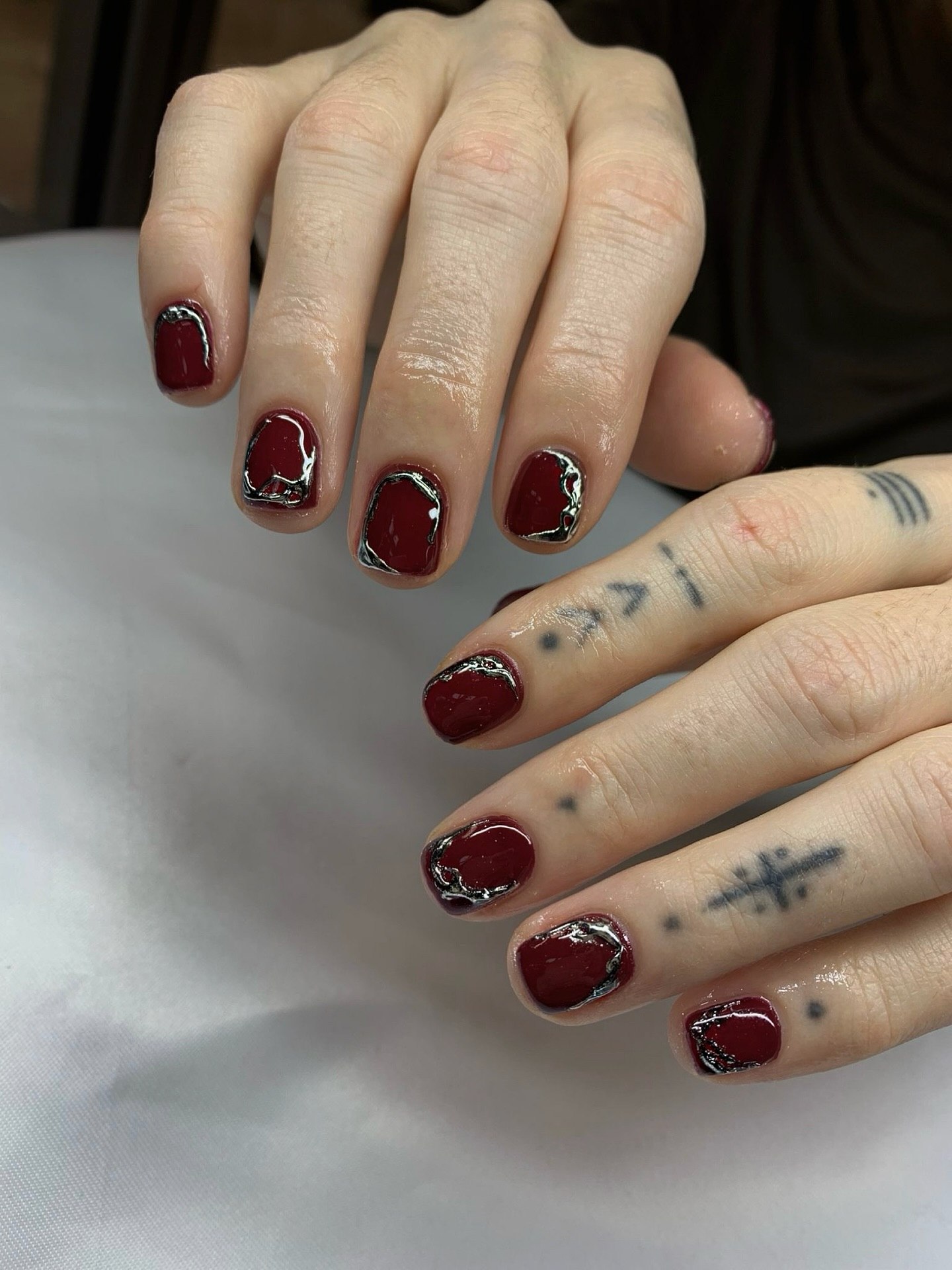 Glossy Burgundy Nails With Silver Abstract Art