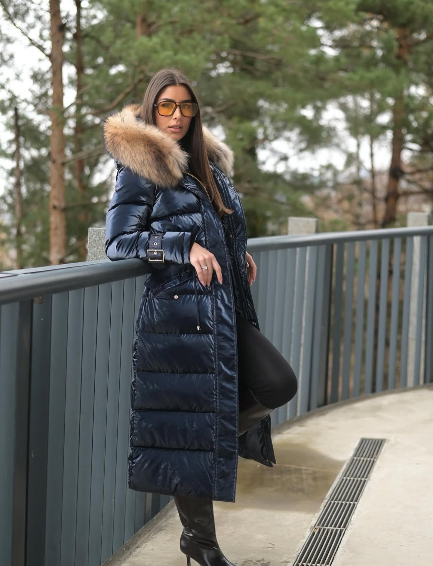 Long Puffer Coat With Fur Trim And Knee-High Boots