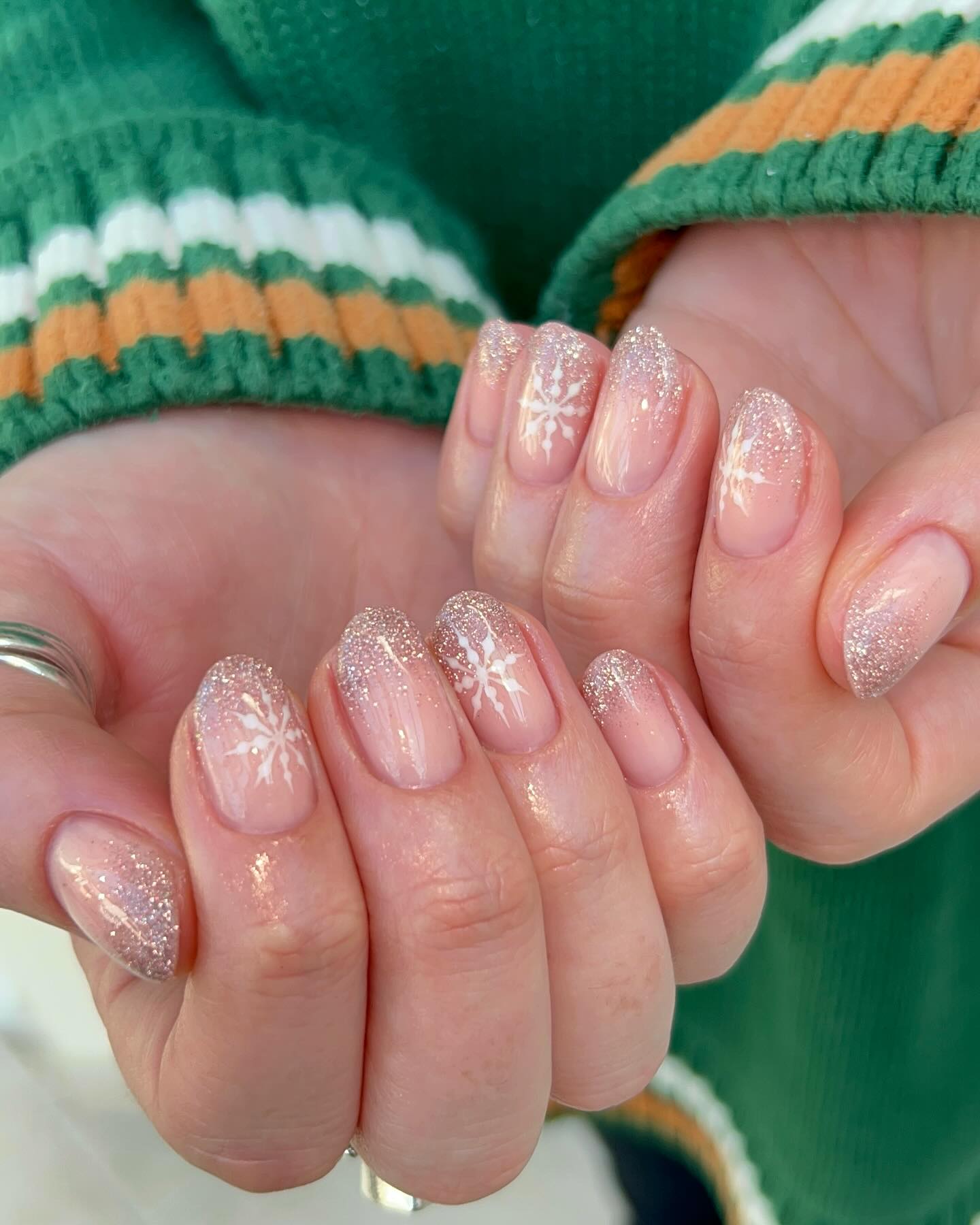 Glossy Nude Nails With Glitter Ombre And Snowflakes