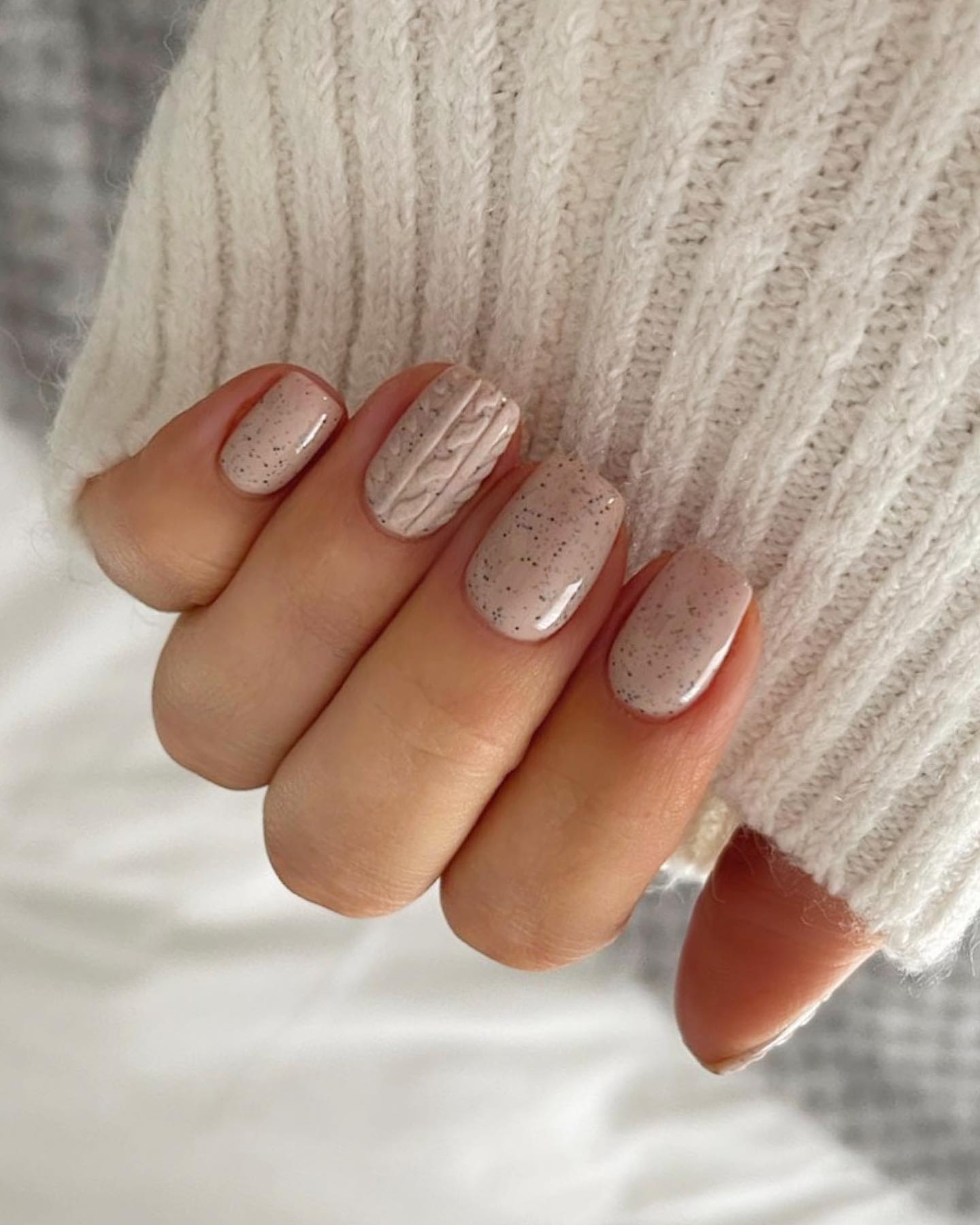 Cozy Speckled Nude Nails With Cable Knit Accent