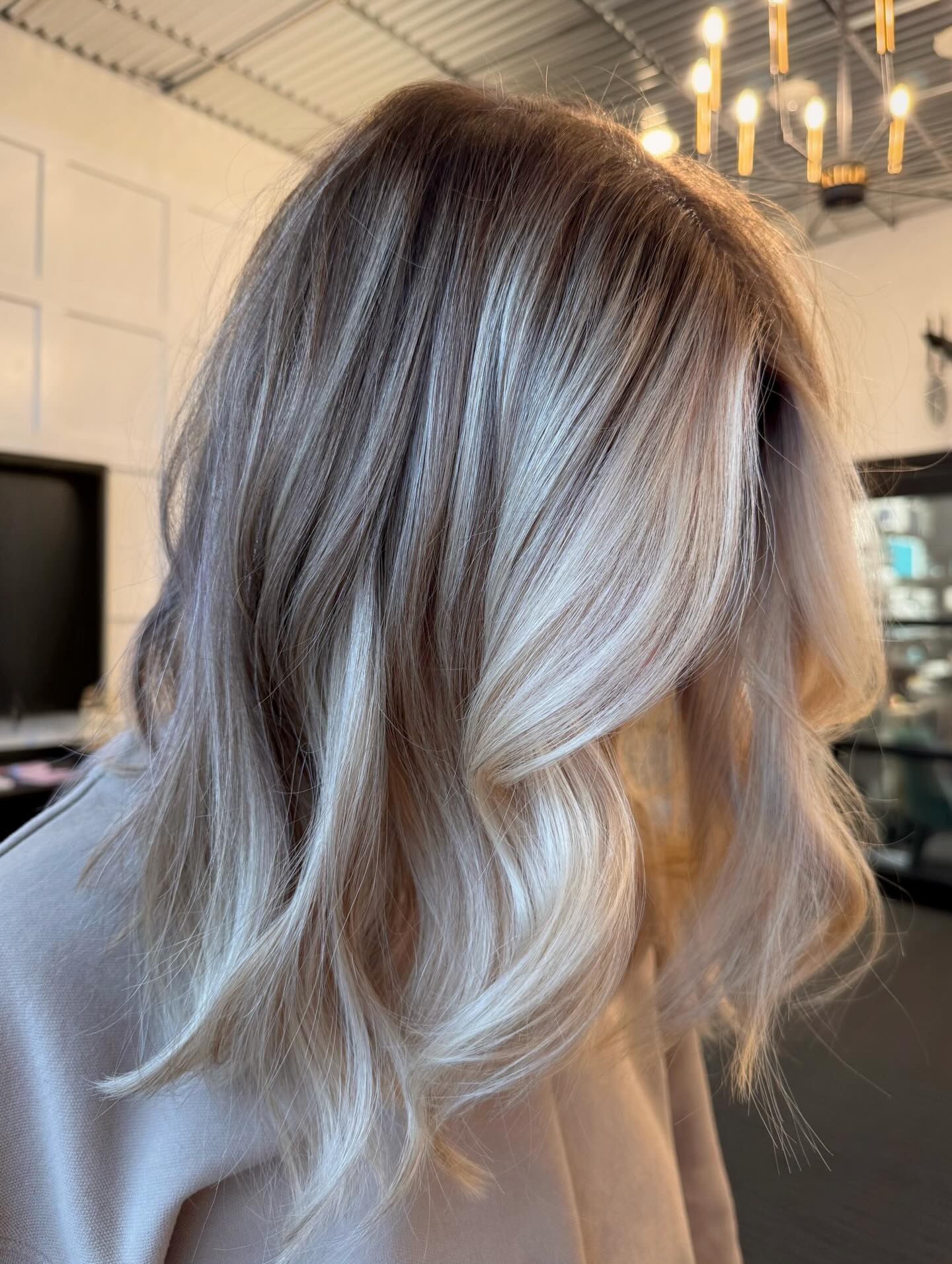 Dimensional Ash Blonde Balayage With Soft Waves