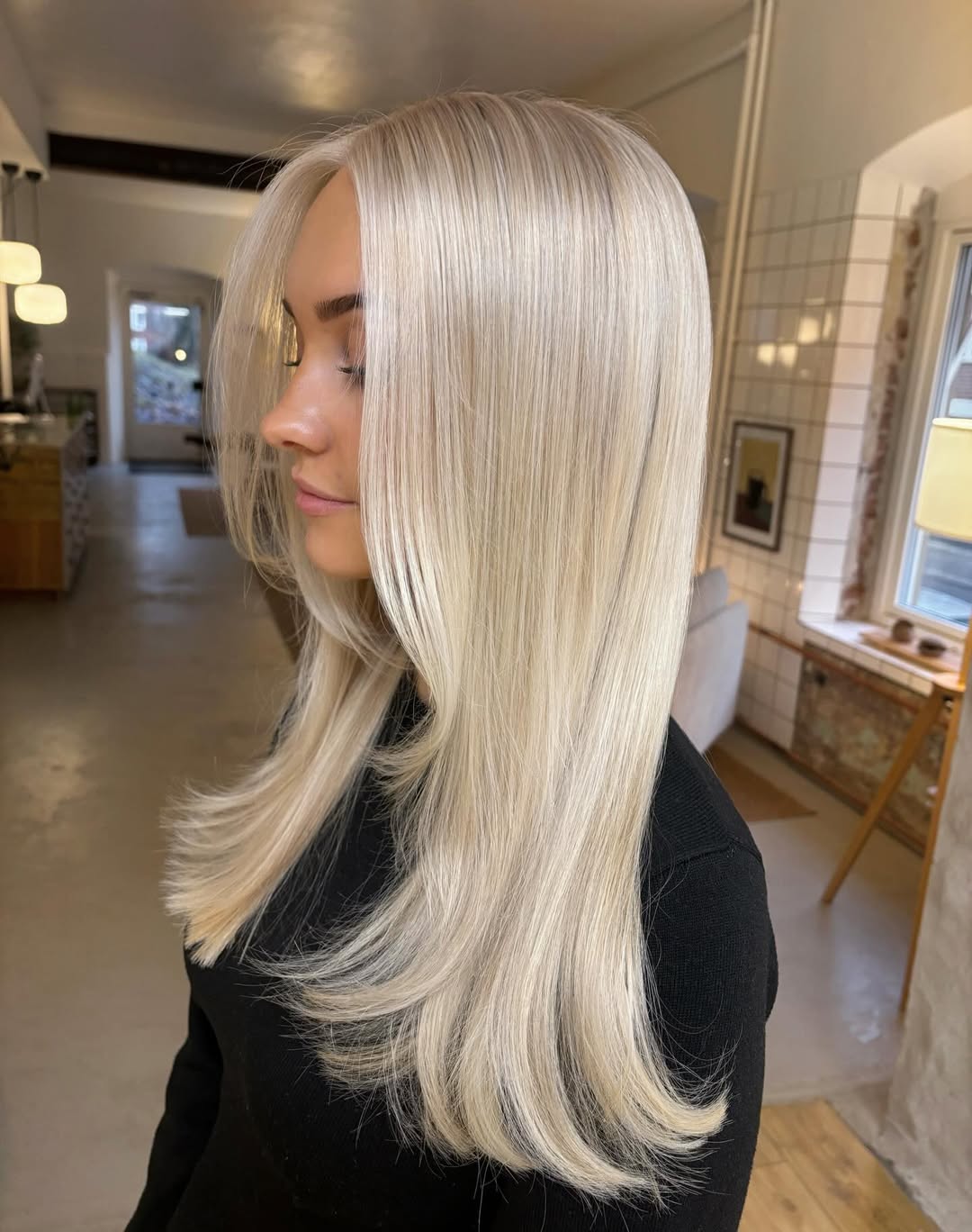 Silky Platinum Blonde Layers With Face Framing