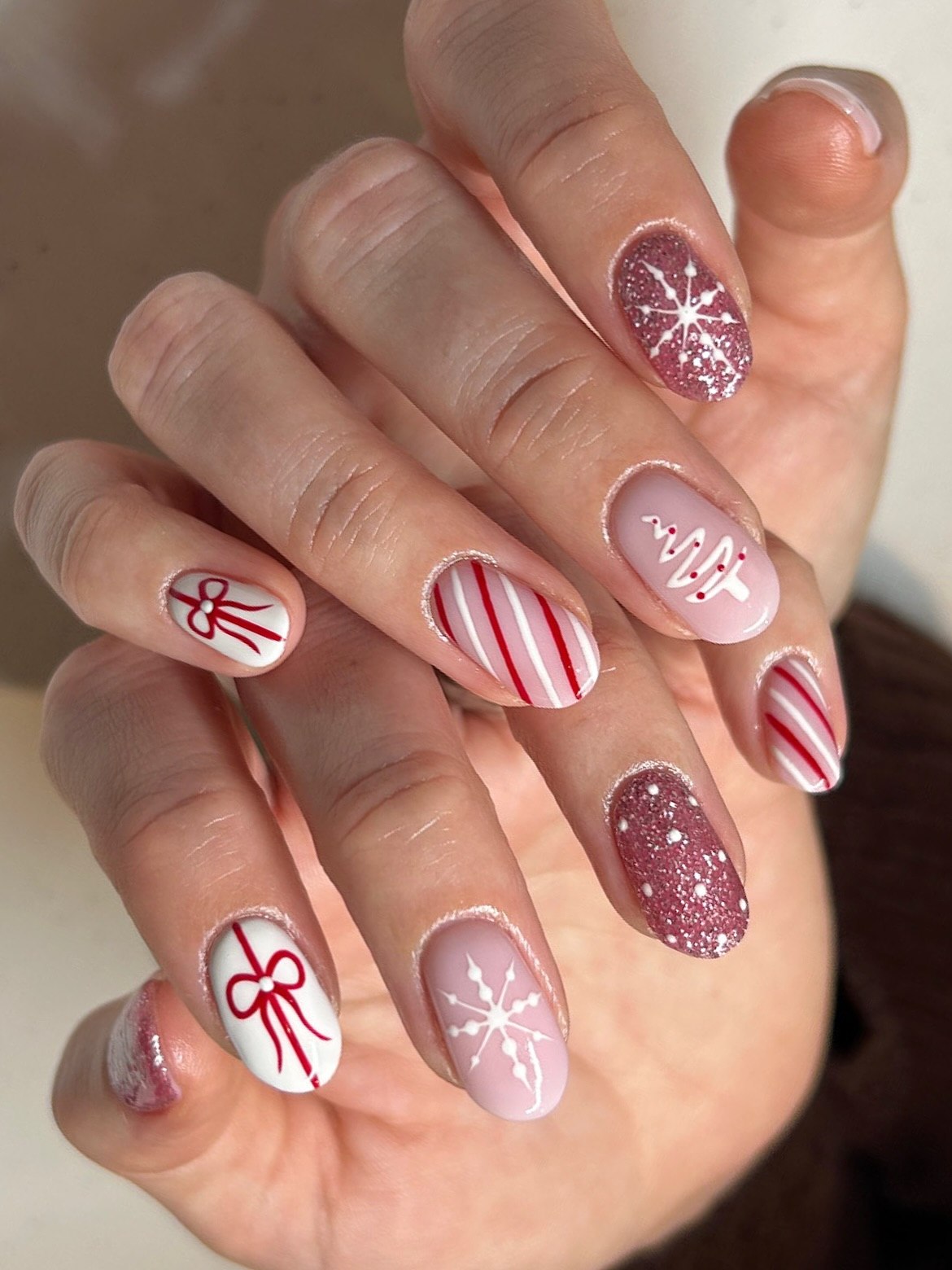Festive Christmas Bow and Snowflake Oval Nails