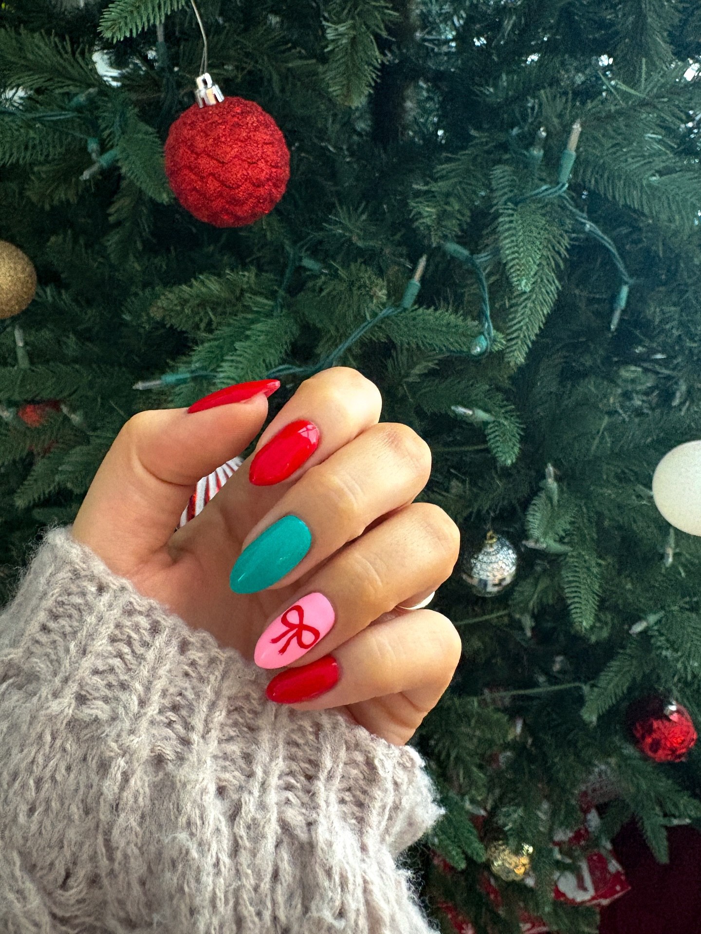 Festive Candy Cane Bow Almond Nails