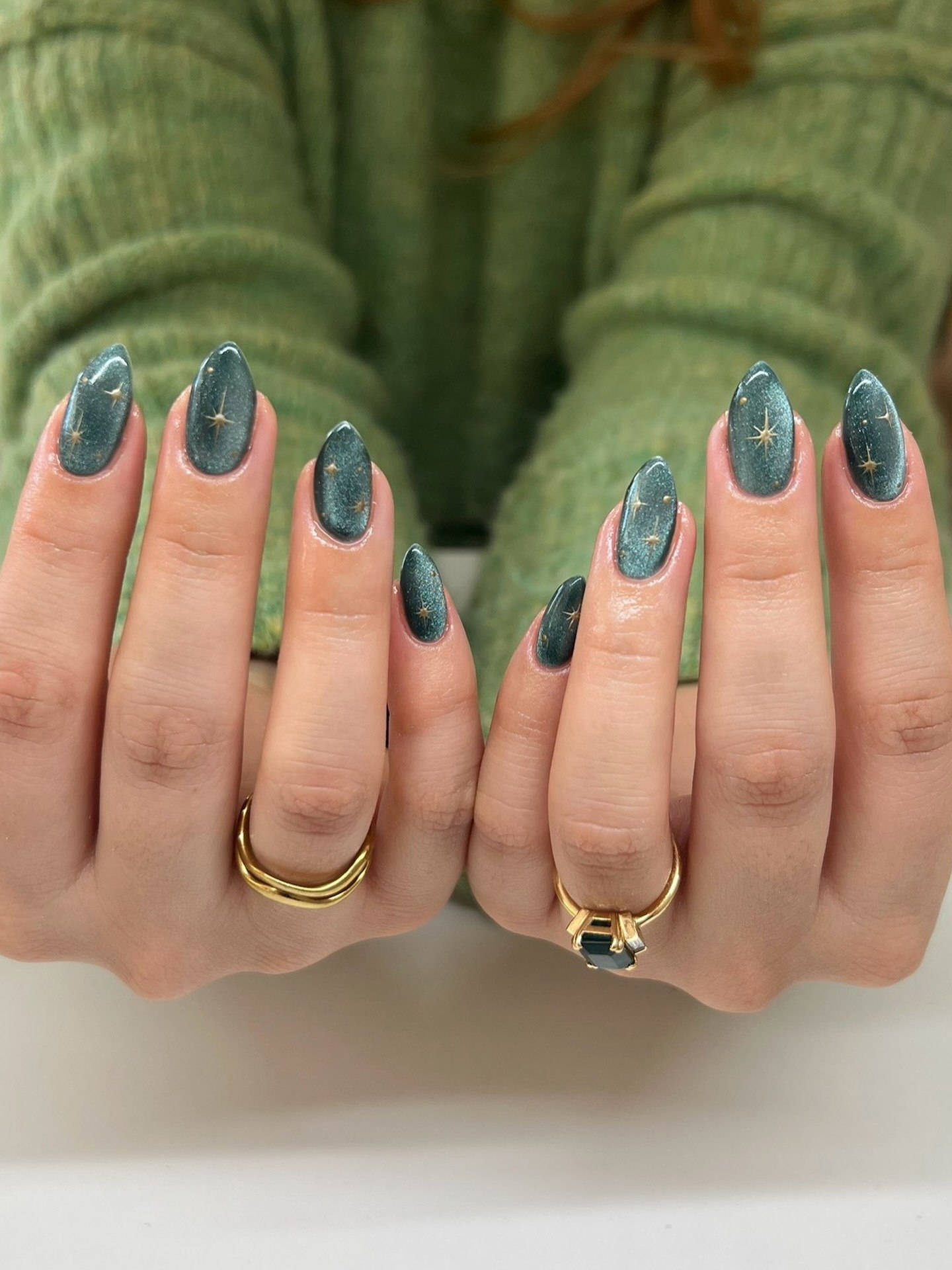 Teal Cat Eye Starburst Almond Nails