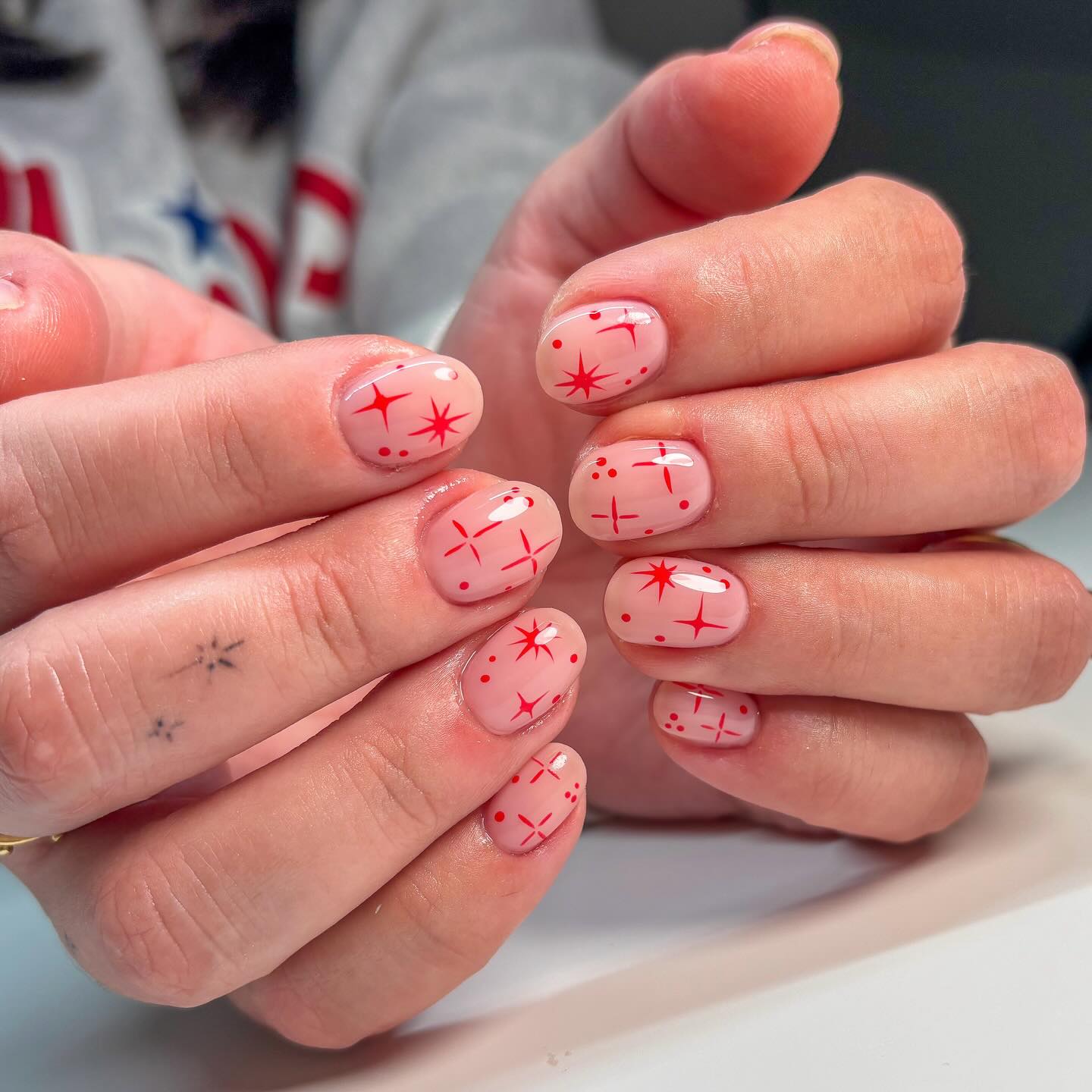 Pink Milky Nails with Red Star Accents
